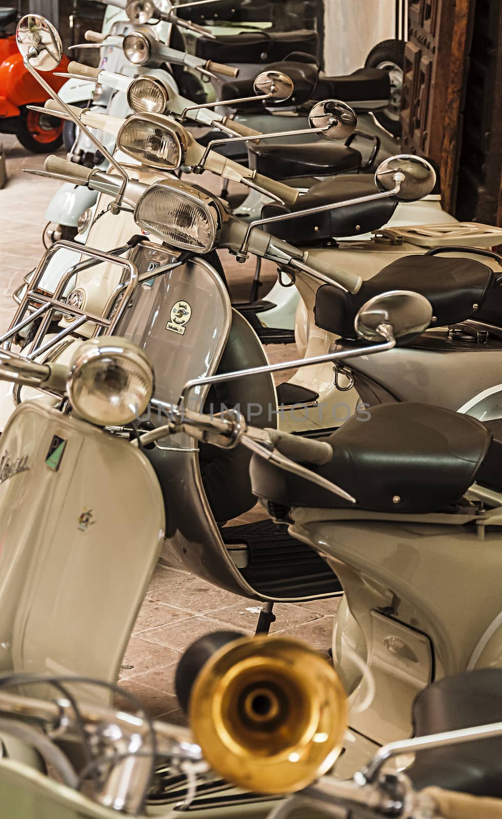 URBINO - NOVEMBER 3: old Vespa scooters in an historical museum on November 3, 2013 in Urbino, Italy