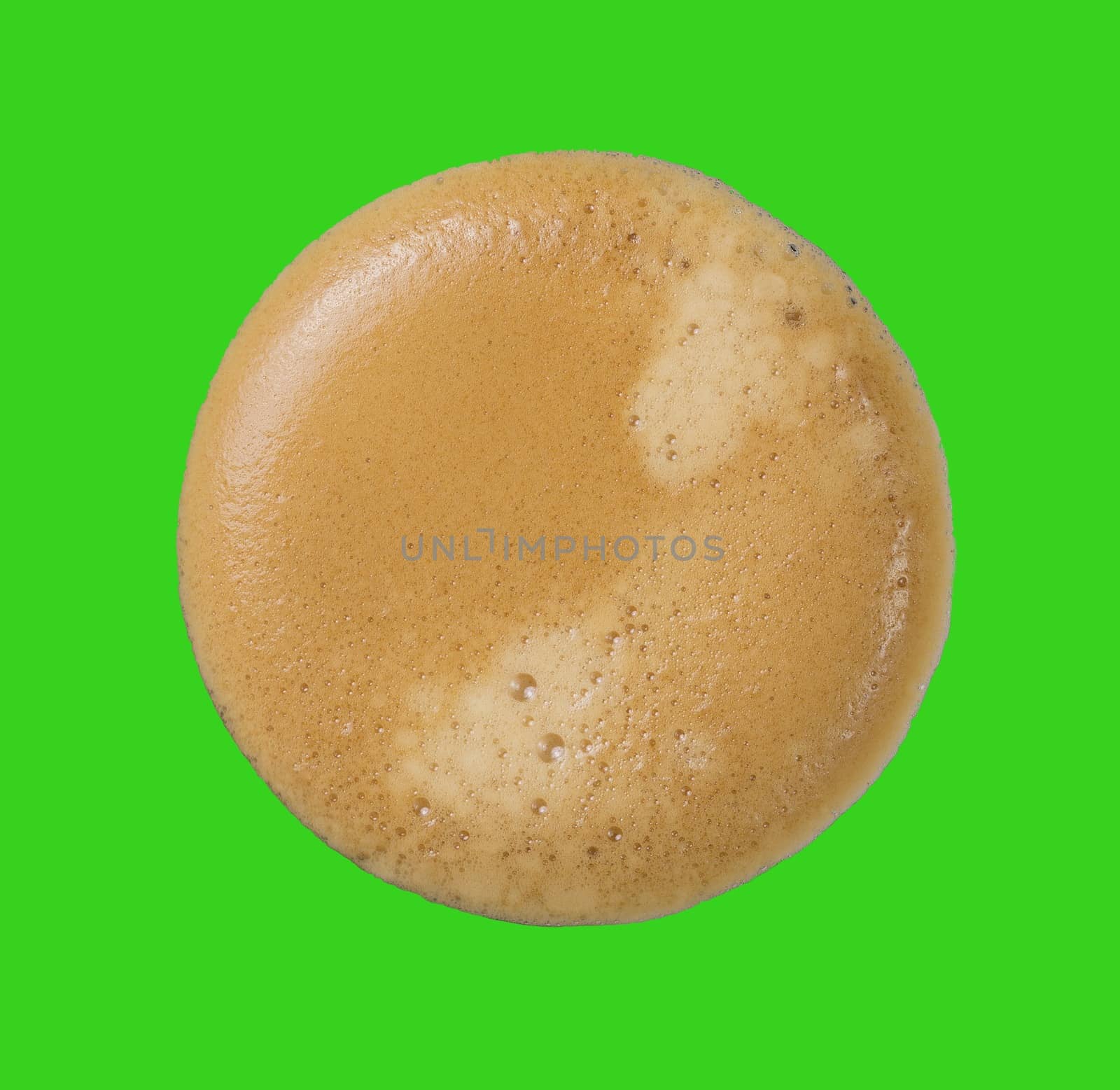 Top view of coffee cream with green background.