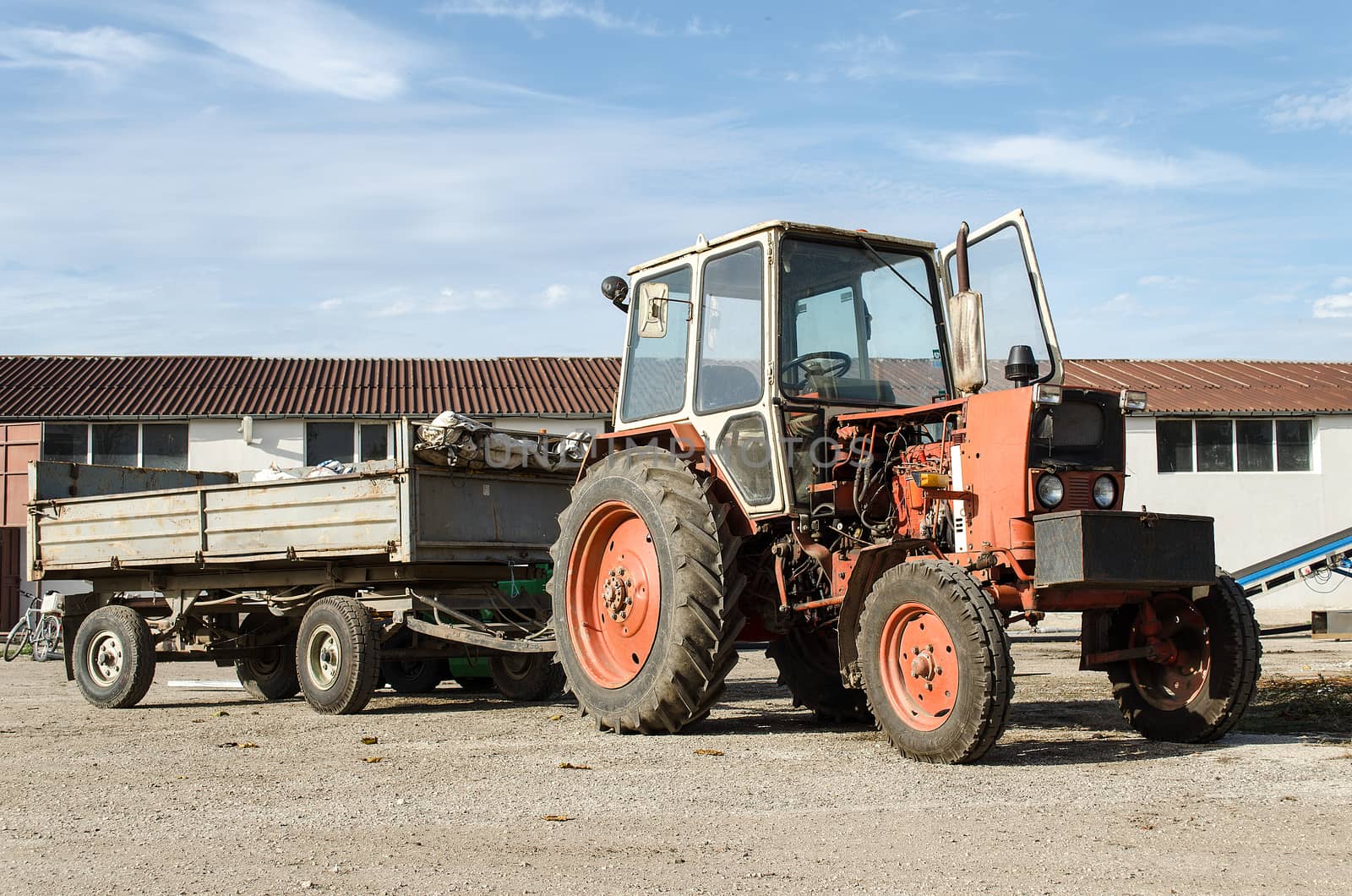 Old farm tractor may be still in use, but very rusty