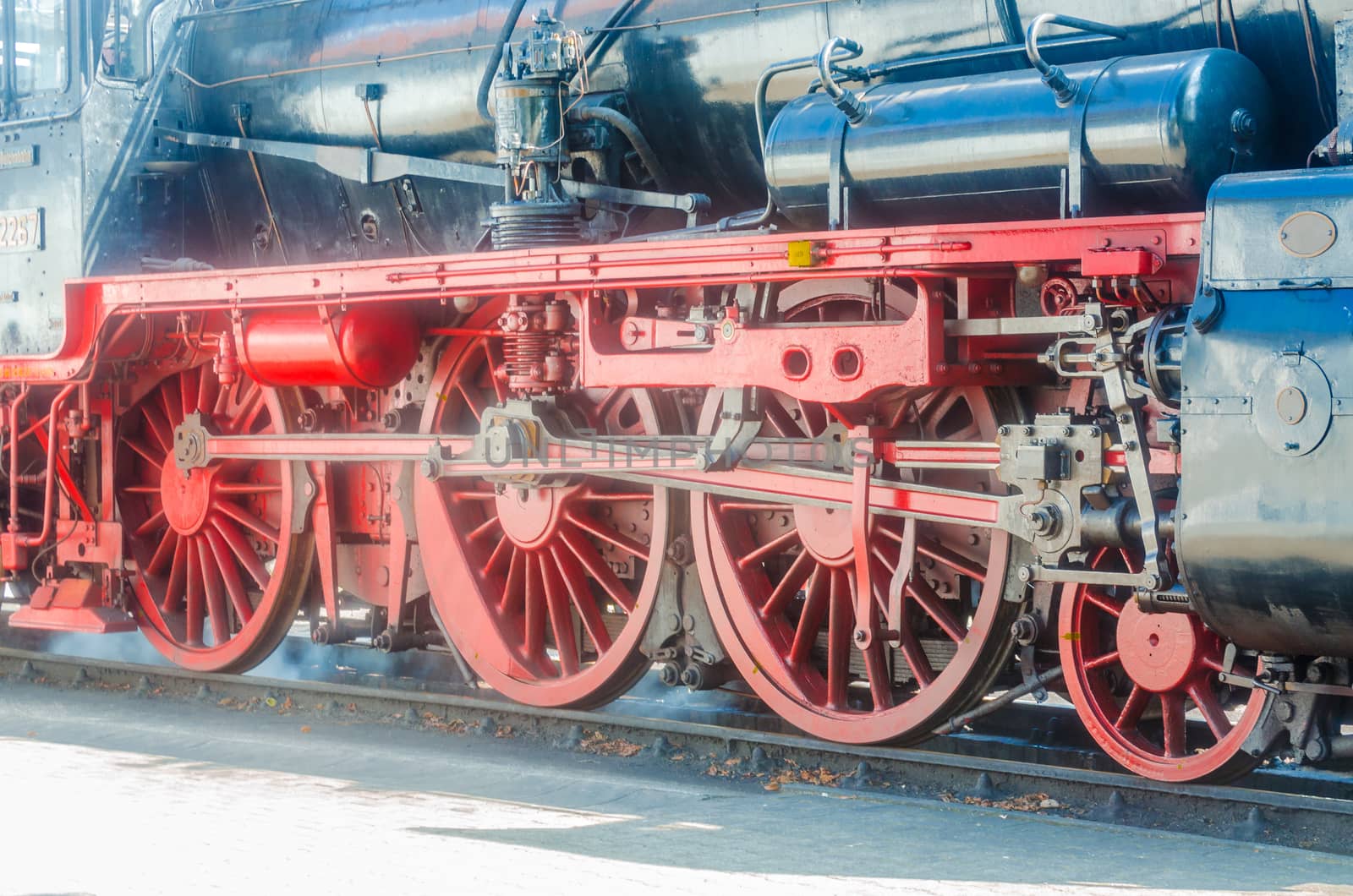 Wheels of a steam locomotive chassis when driving