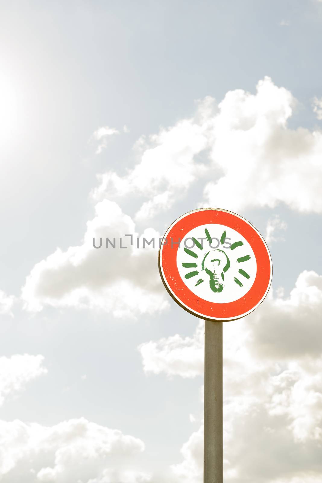 wayfinding round symbol with conceptual and sky in the background