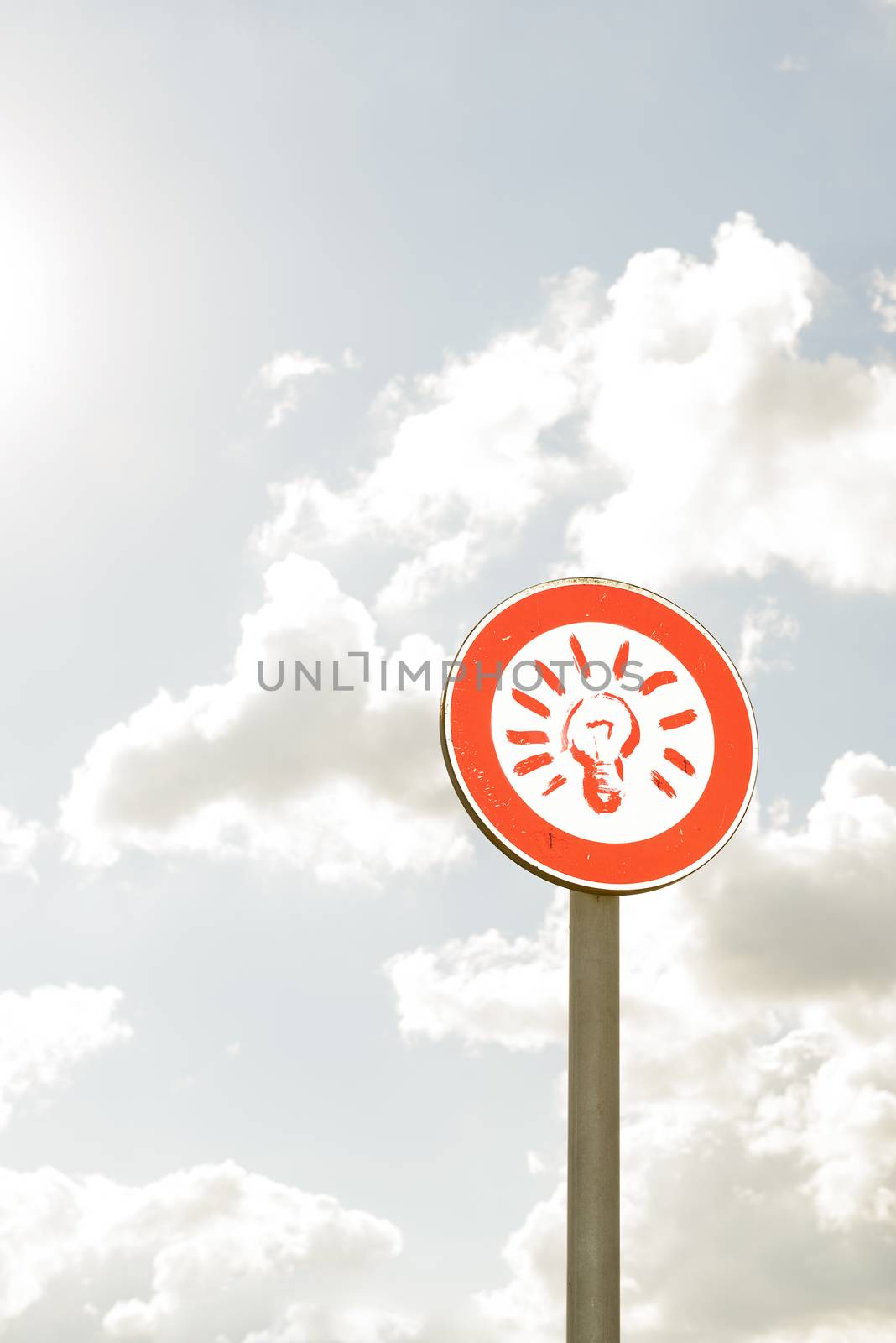 wayfinding round symbol with conceptual and sky in the background