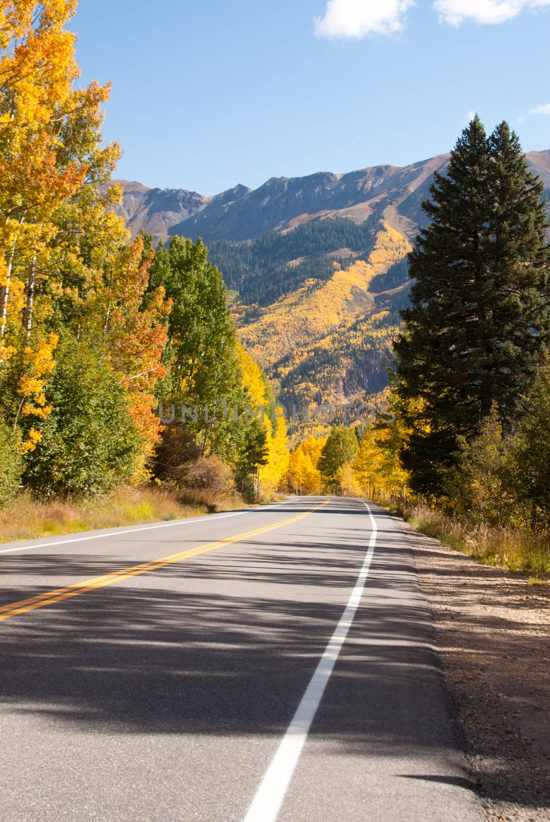 Colorado mountain road in Fall by emattil