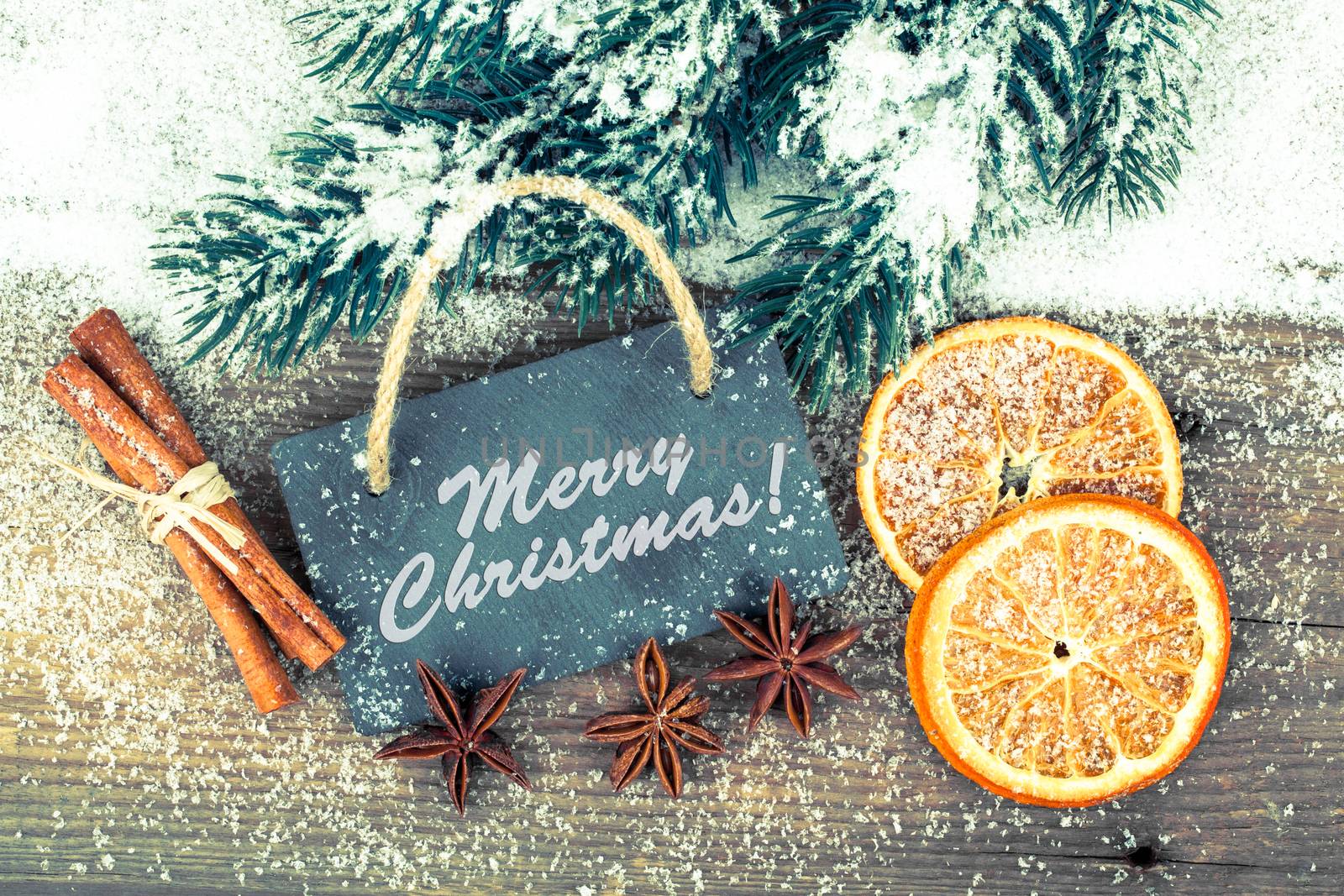 Christmas decoration with slate board, over wooden background