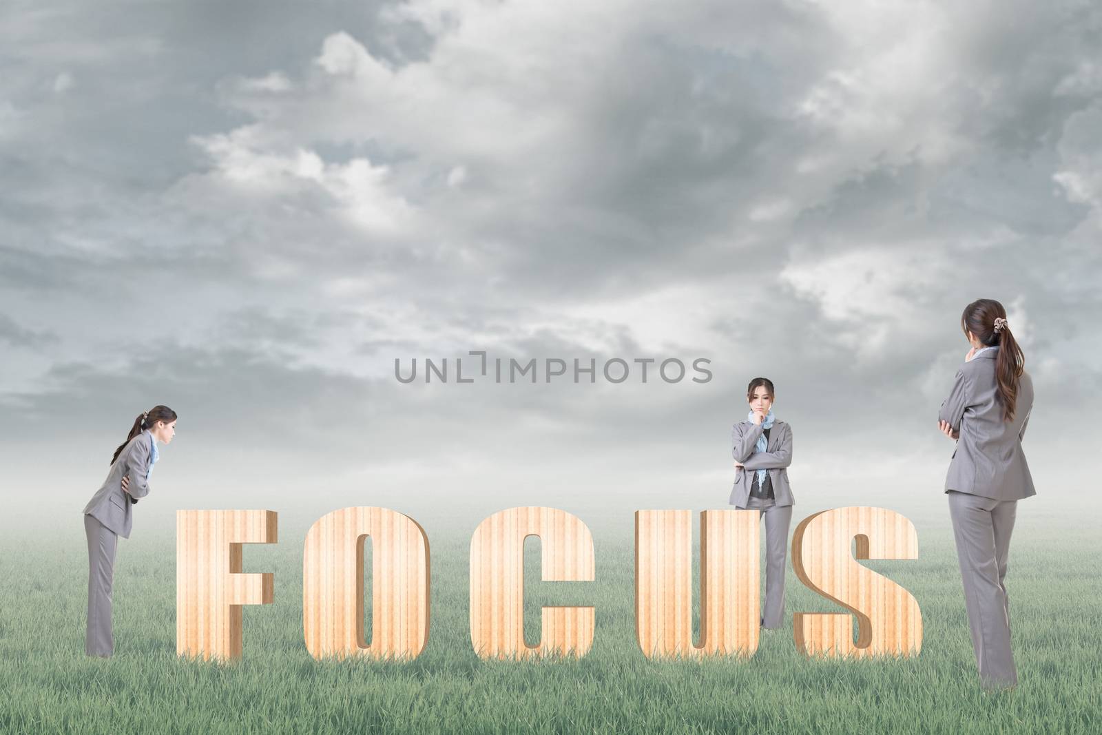 Concept of focus, point, center etc with 3d wooden text and businesswoman under copyspace sky. The Asian woman is the same one.