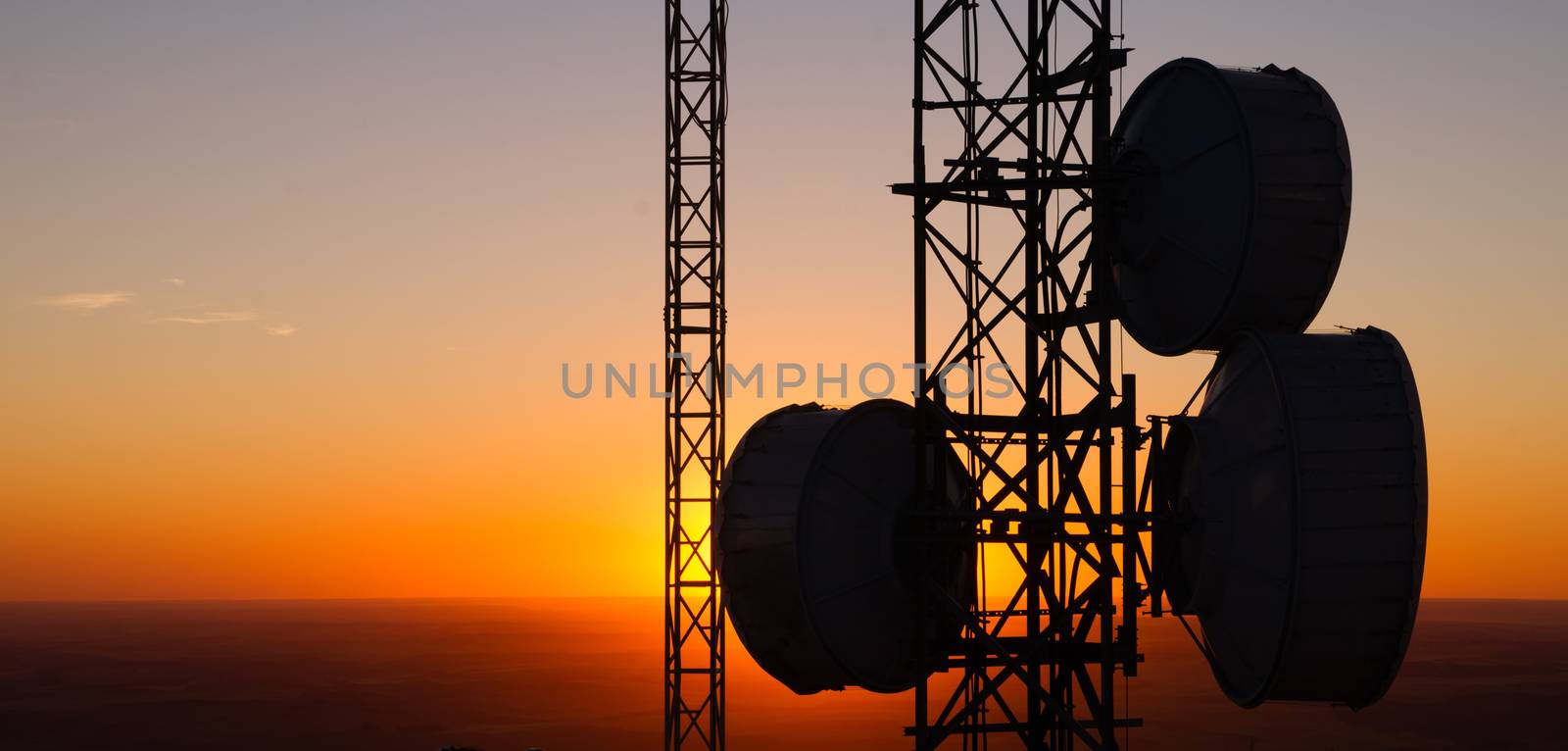 Cellular Radio Wave Communication Towers Evening Sunset Horizon by ChrisBoswell