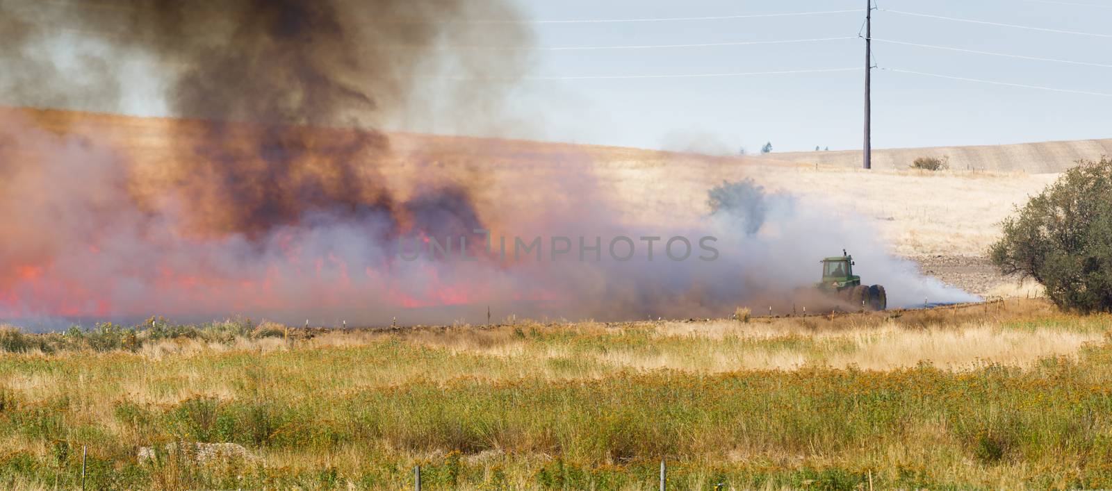 Agricultural Farmers Burn Plant Stalks Harvest Fire Tractor by ChrisBoswell