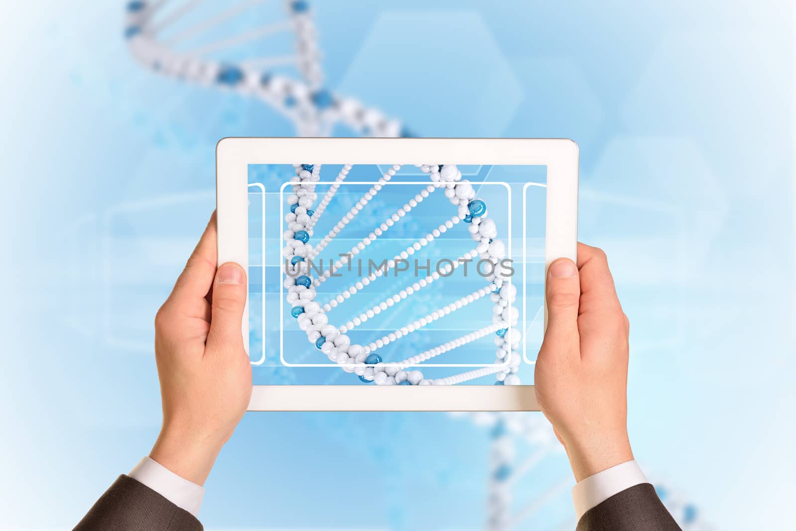 Man hands using tablet pc. Image of DNA helix on tablet screen