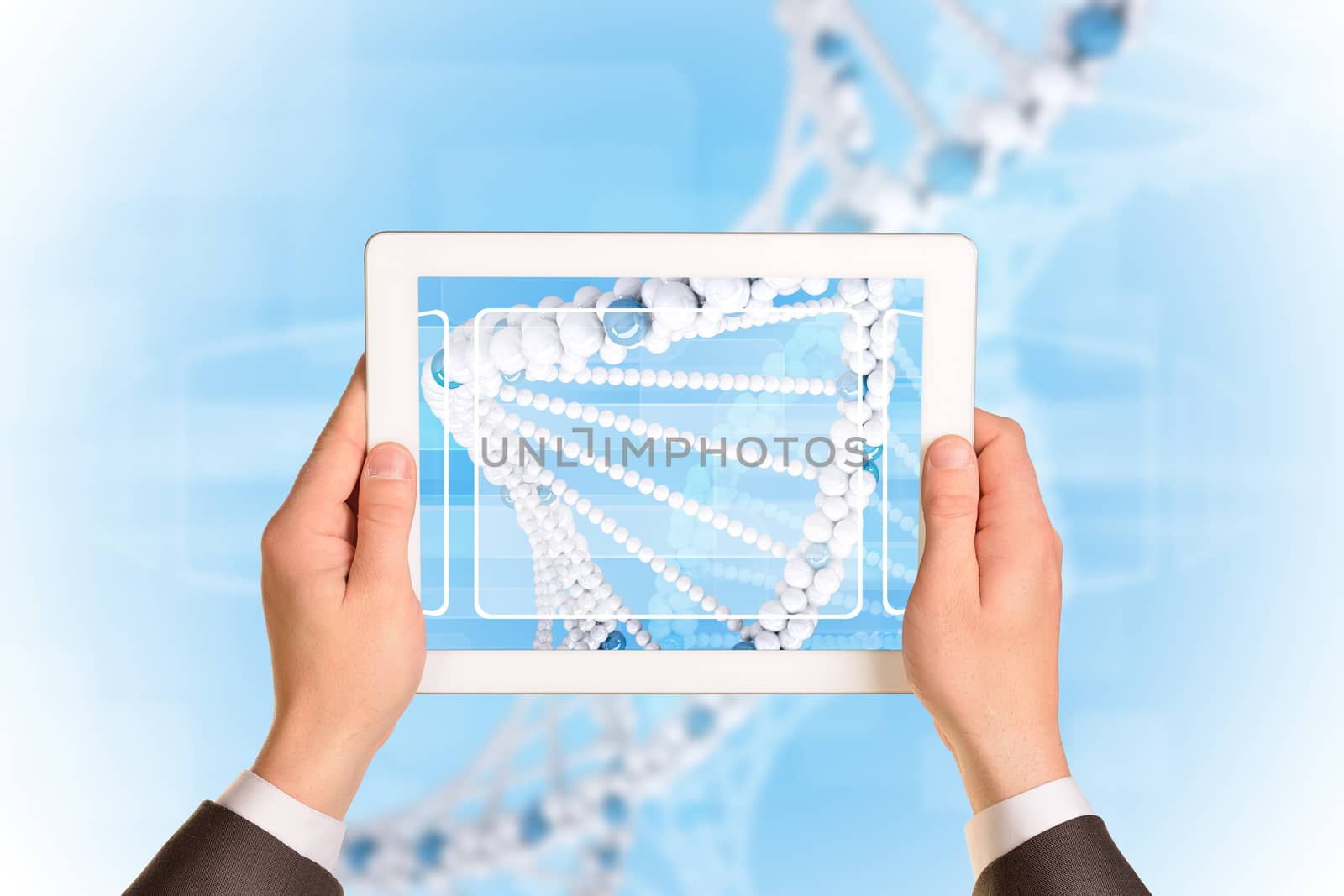 Man hands using tablet pc. Image of DNA helix on screen by cherezoff