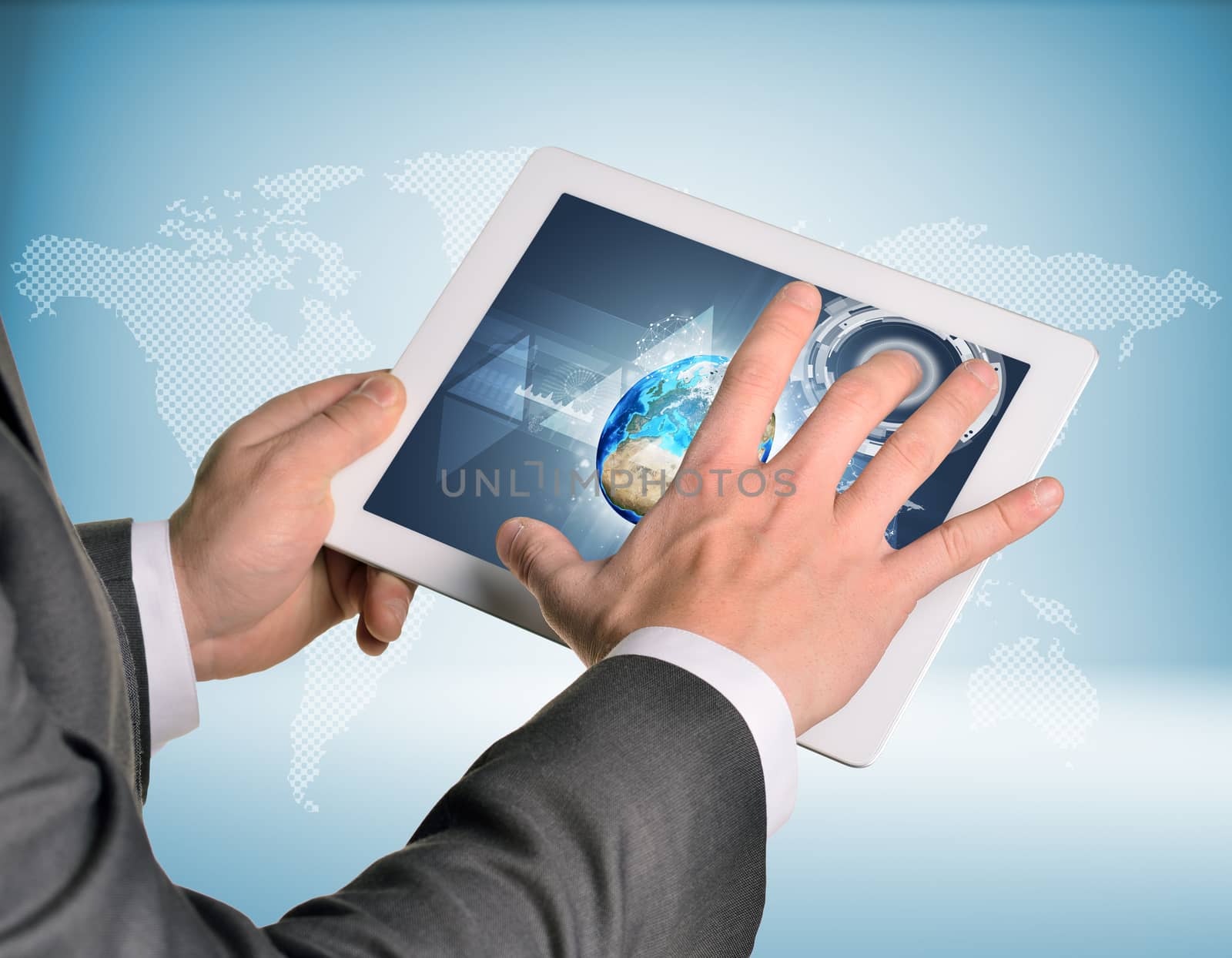 Man hands using tablet pc. Image of Earth on screen by cherezoff