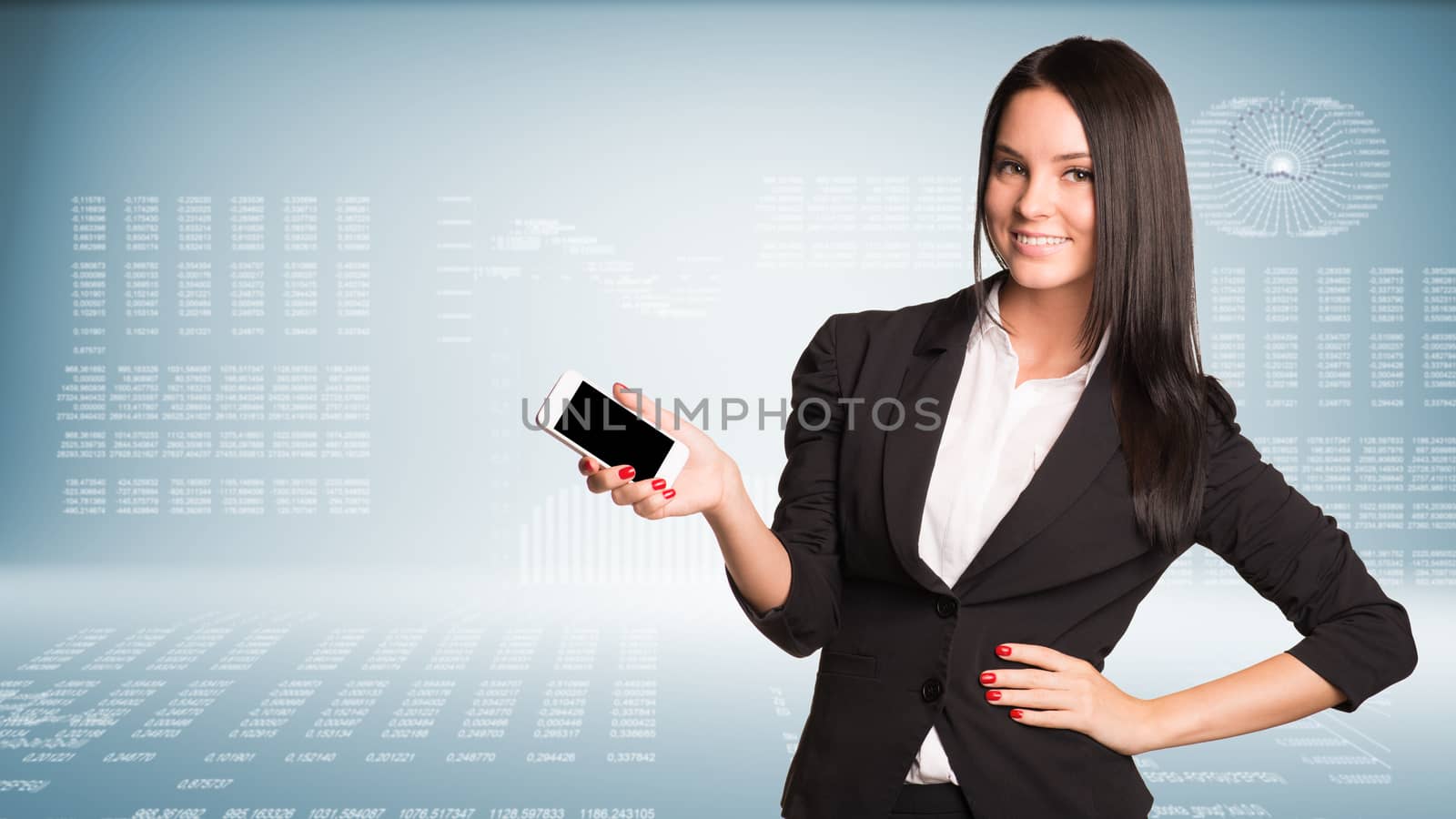 Businesswoman holding smart phone and smiling by cherezoff