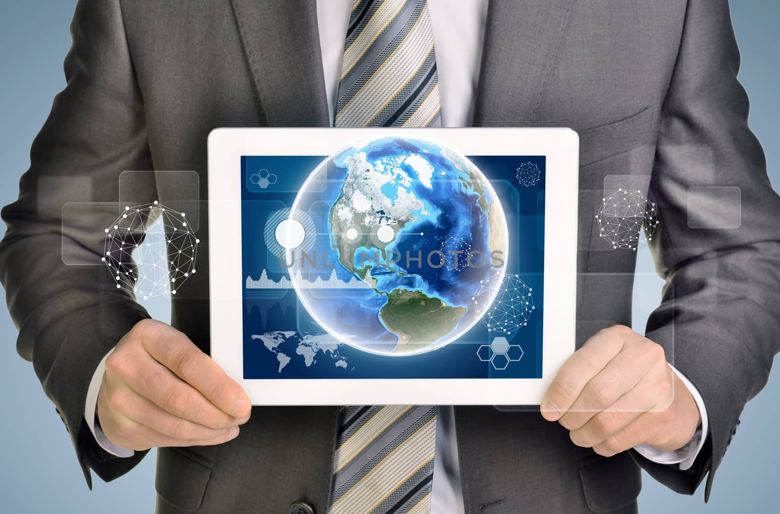 Man hands using tablet pc. Image of Earth and business elements on tablet screen. Element of this image furnished by NASA