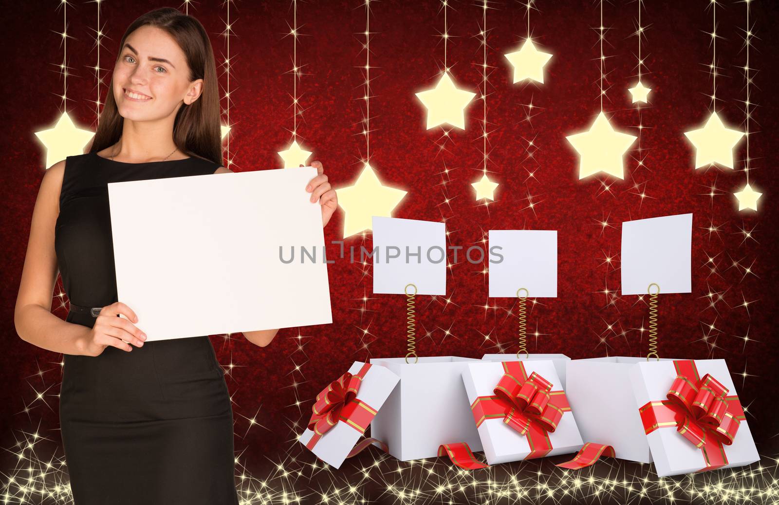 Businesswoman holding empty paper. Christmas gifts as backdrop