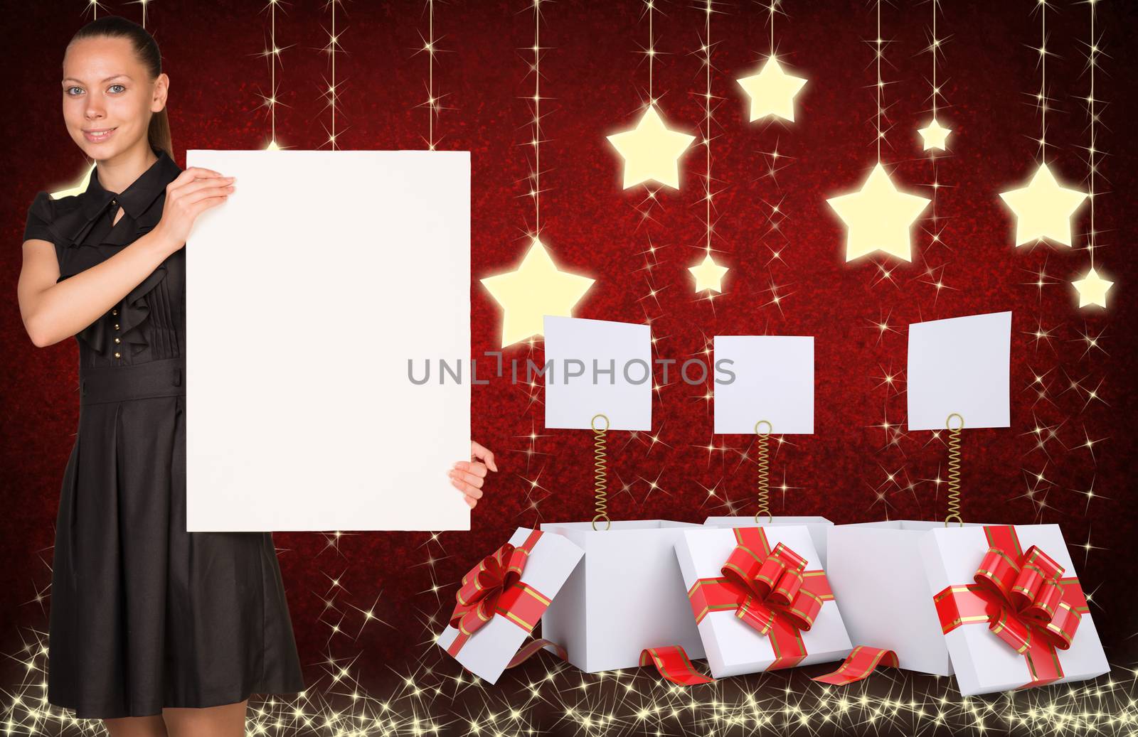 Businesswoman holding empty paper. Christmas gifts as backdrop