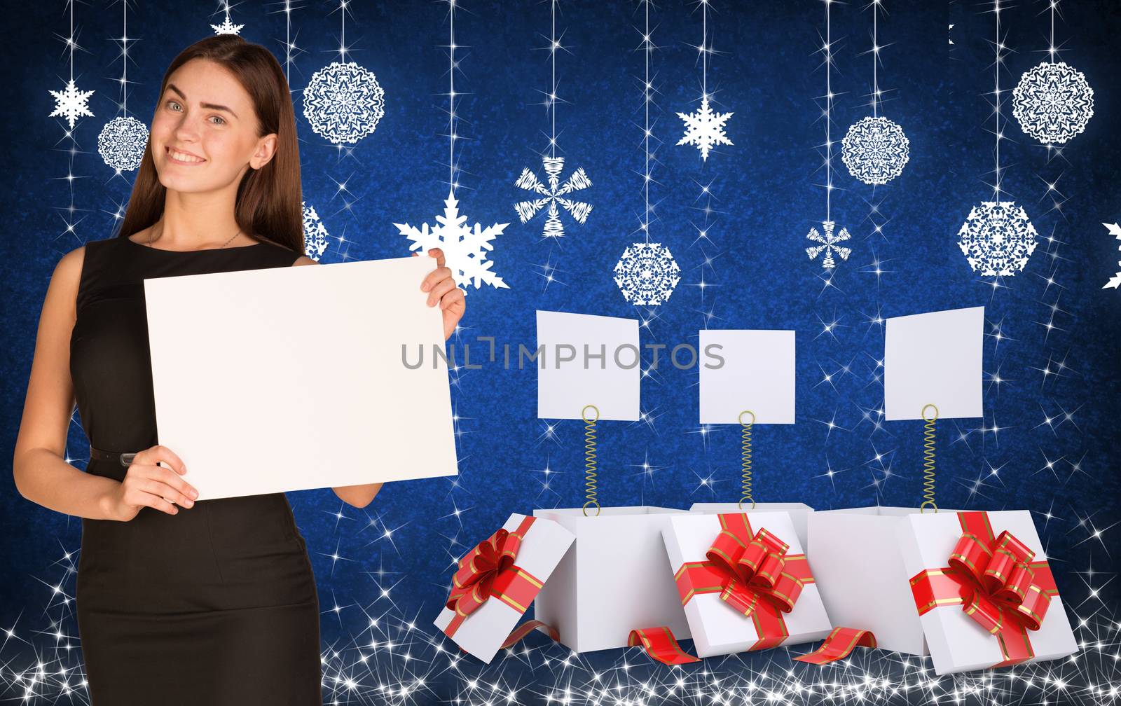Businesswoman holding empty paper. Christmas gifts as backdrop