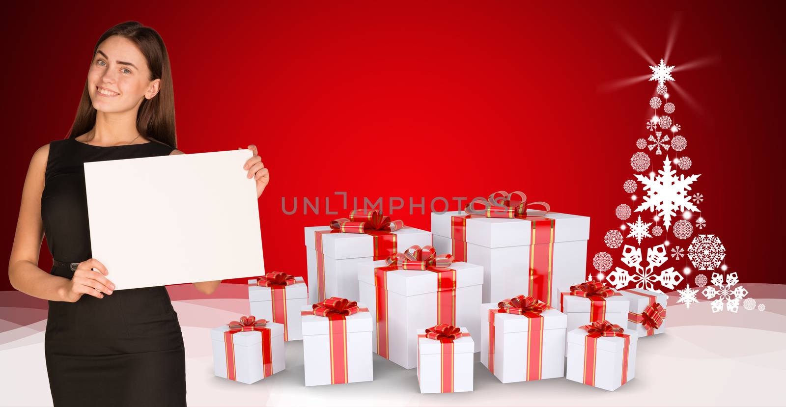 Businesswoman holding empty paper. Christmas tree and gifts as backdrop