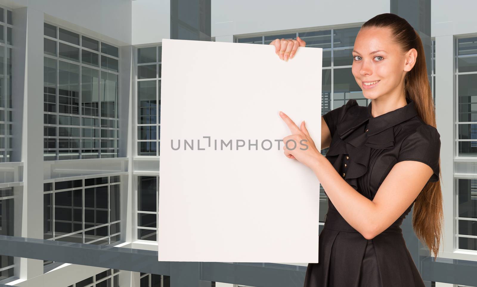 Businesswoman holding empty paper. Large window in office building as background