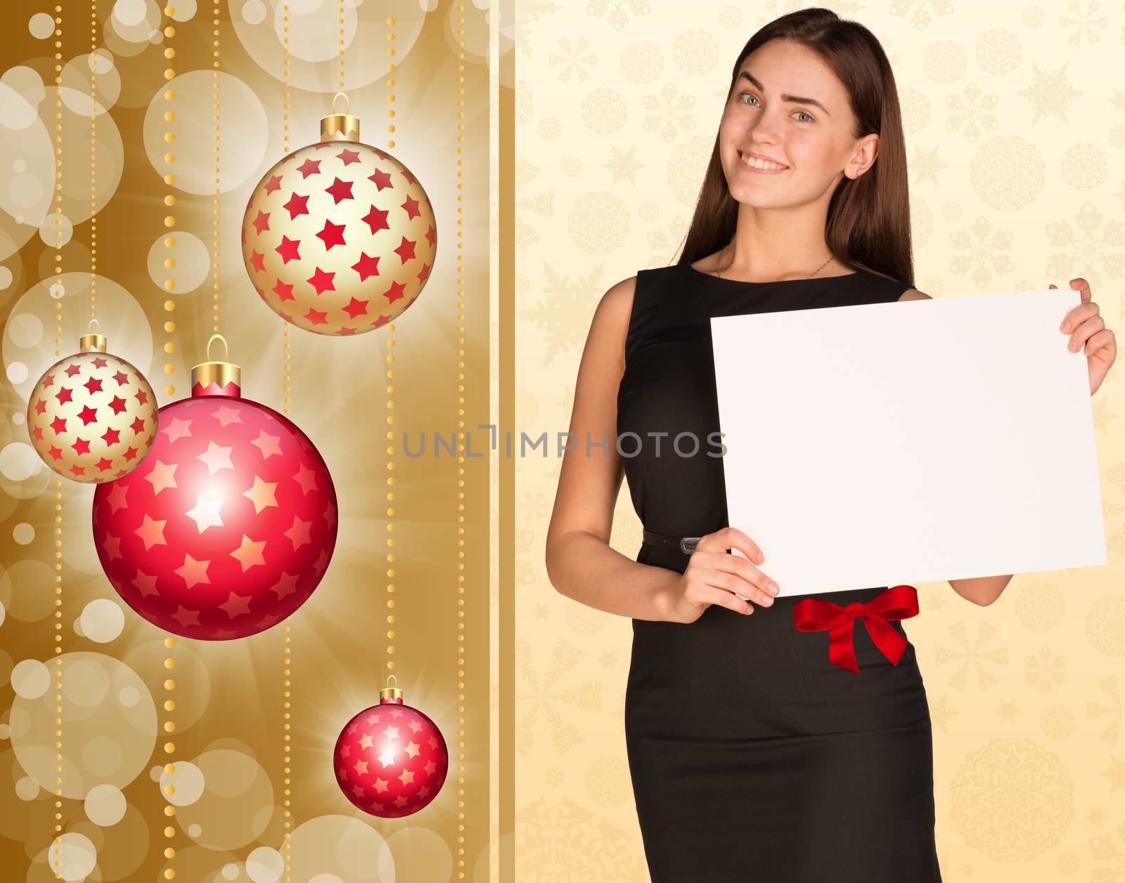 Businesswoman holding empty paper. Christmas tree balls as backdrop