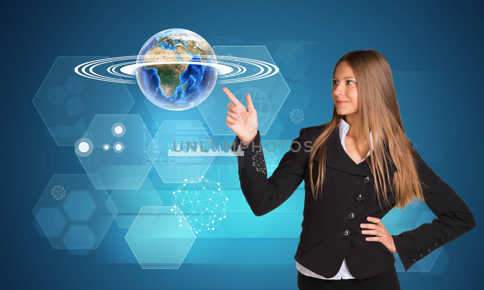 Beautiful businesswoman finger presses Earth. Hexagons and graphs by cherezoff