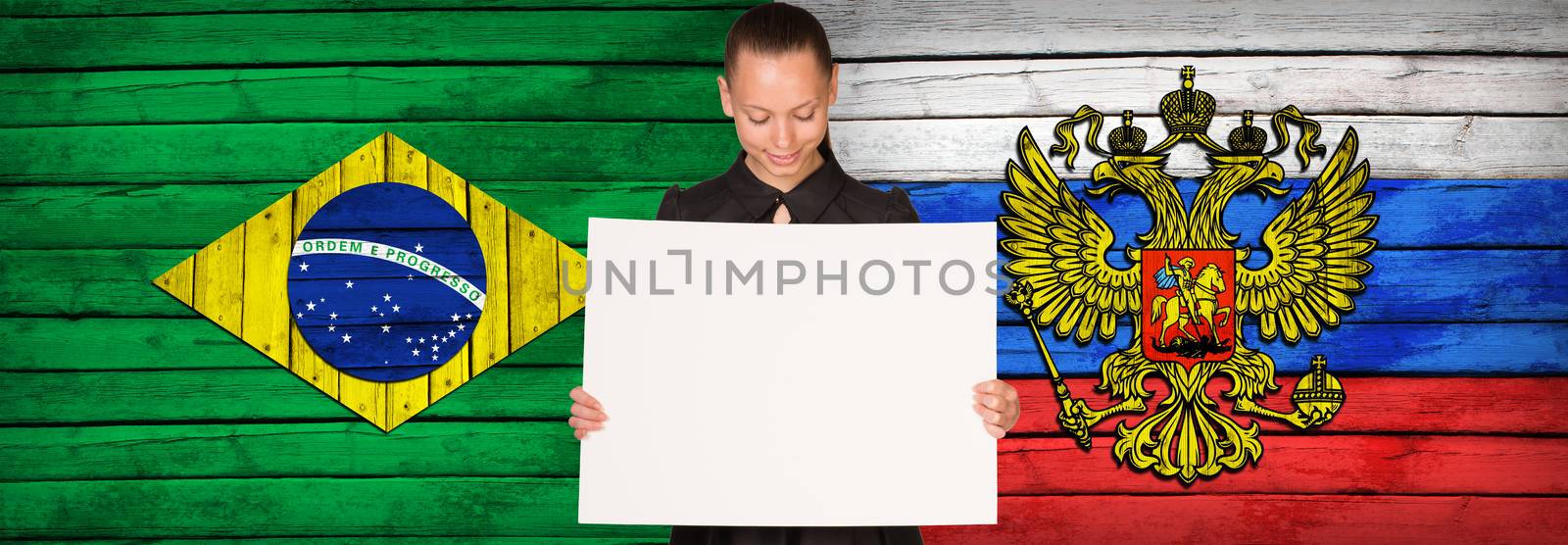 Businesswoman holding paper sheet. Brazil and Russia flags as backdrop
