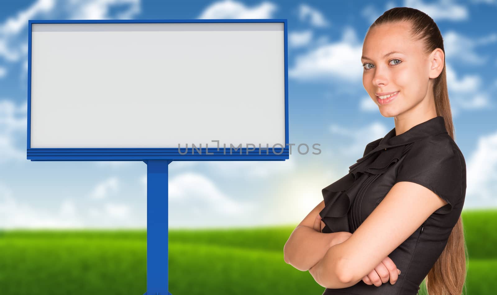 Businesswoman standing with crossed arms. Big empty billboard and blured nature landscape as backdrop