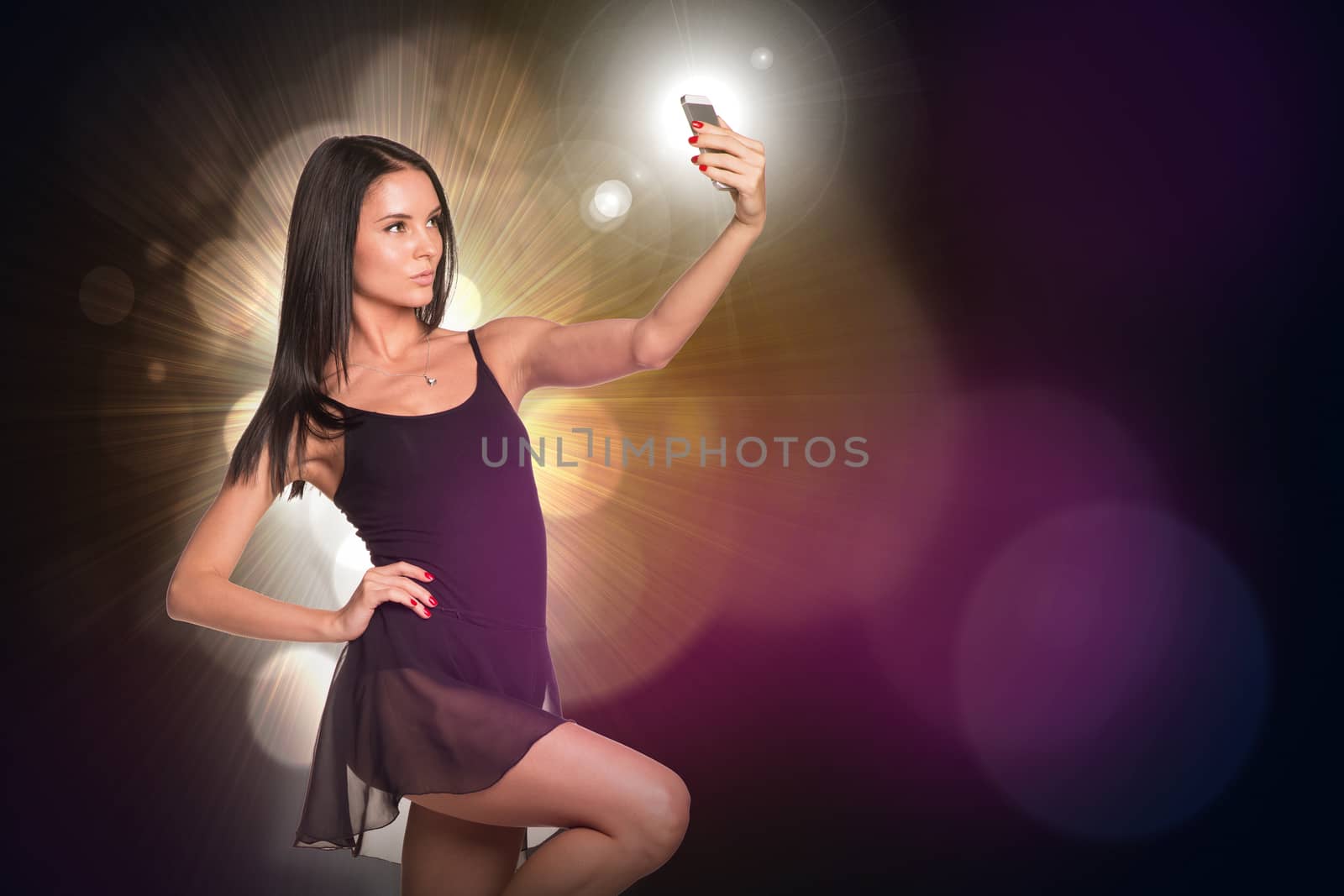 Beautiful dancer makes selfie from your mobile phone. Abstract background