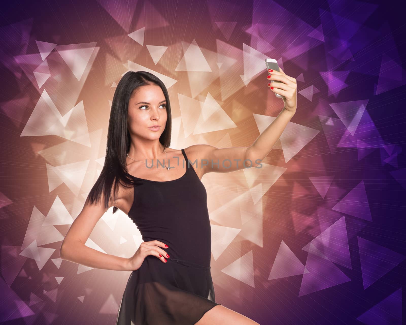 Beautiful dancer makes selfie from your mobile phone. Abstract background