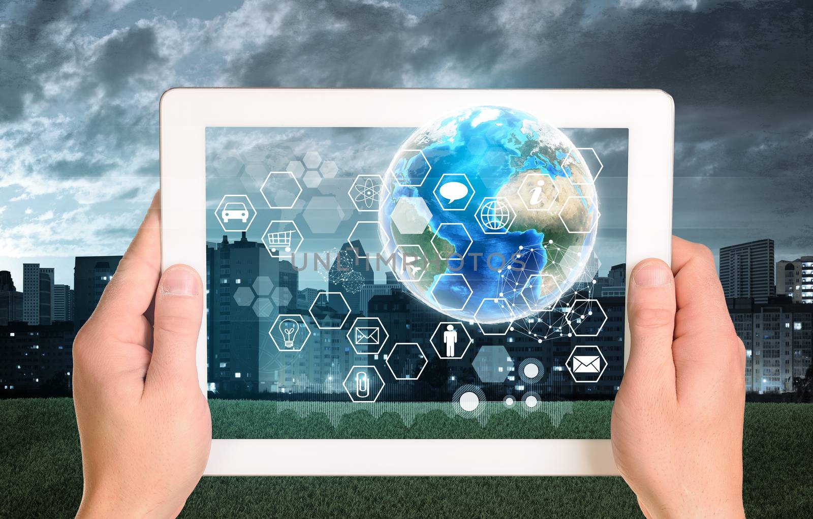 Man hands using tablet pc. Earth and hexagons with icons on touch screen by cherezoff