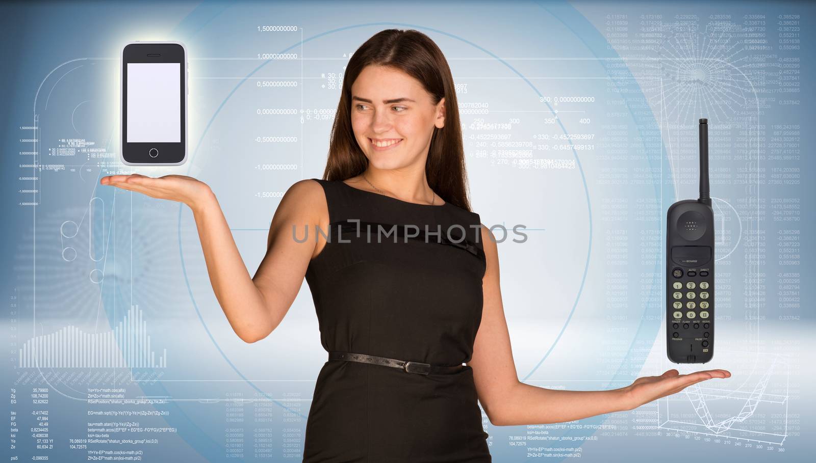 Beautiful businesswoman holding two old phone and smartphone. Smiling and looking at smart phone. Hi-tech graphs as backdrop