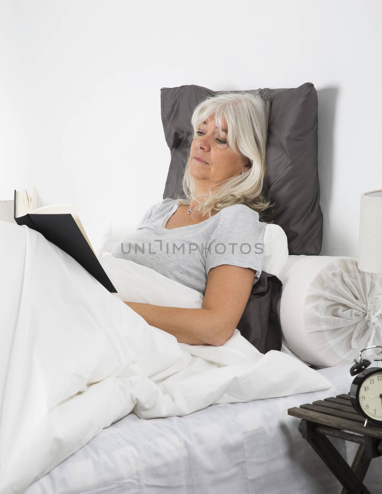Woman reading by gemenacom