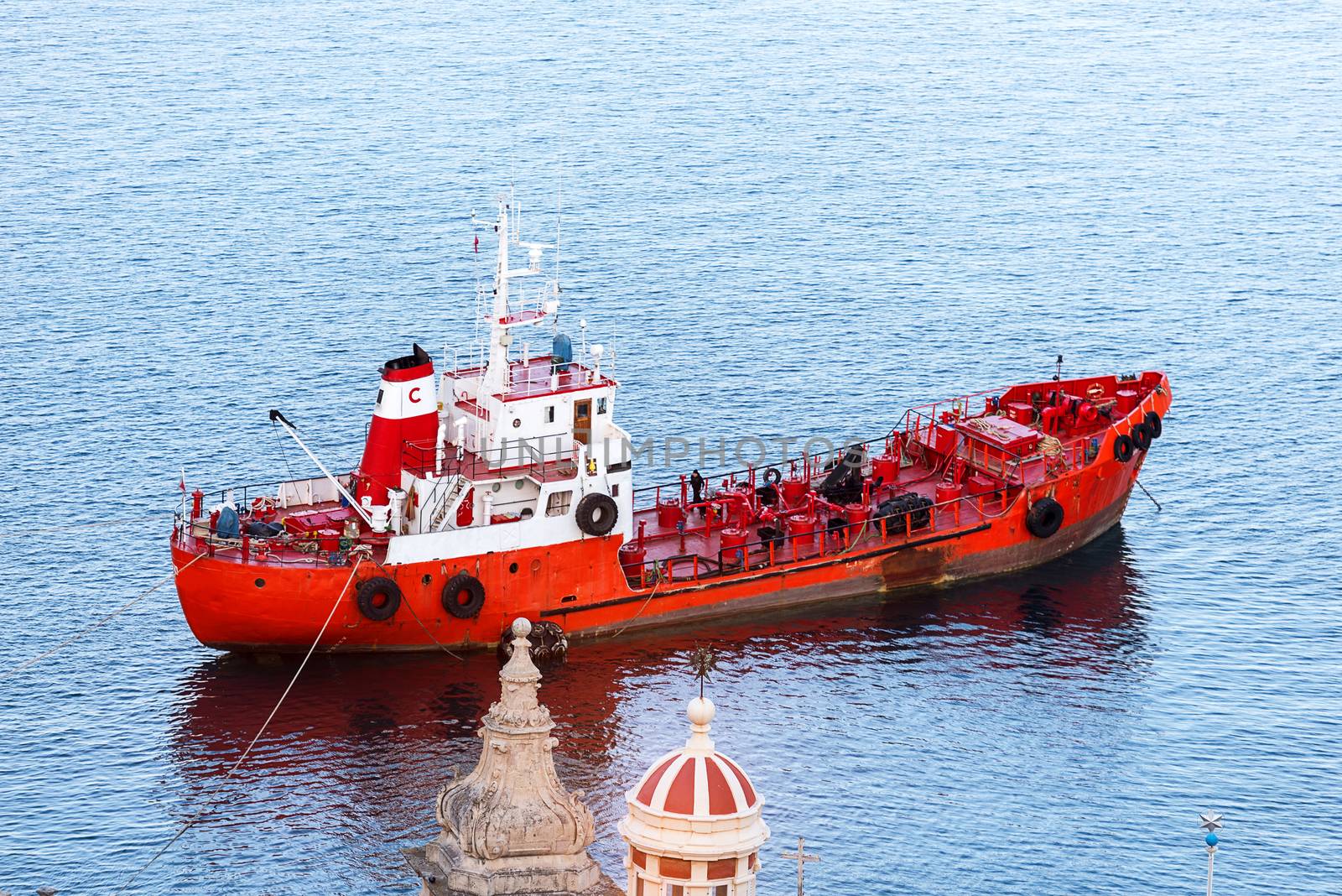 Red ship neat Malta coast by Nanisimova