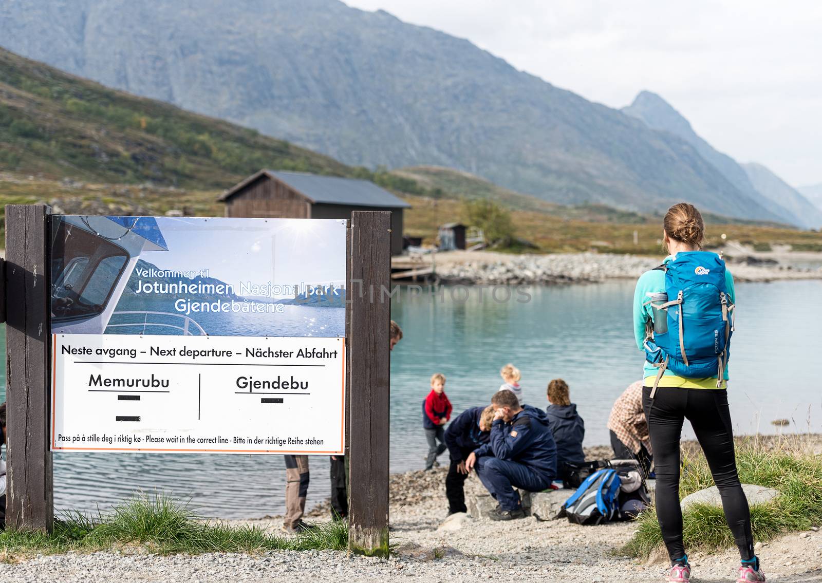 BESSEGGEN, NORWAY - AUGUST 6: Hikers waiting for ferry. Besseggen is one of the most popular mountain hikes in Norway. About 30,000 people walk this trip each year.