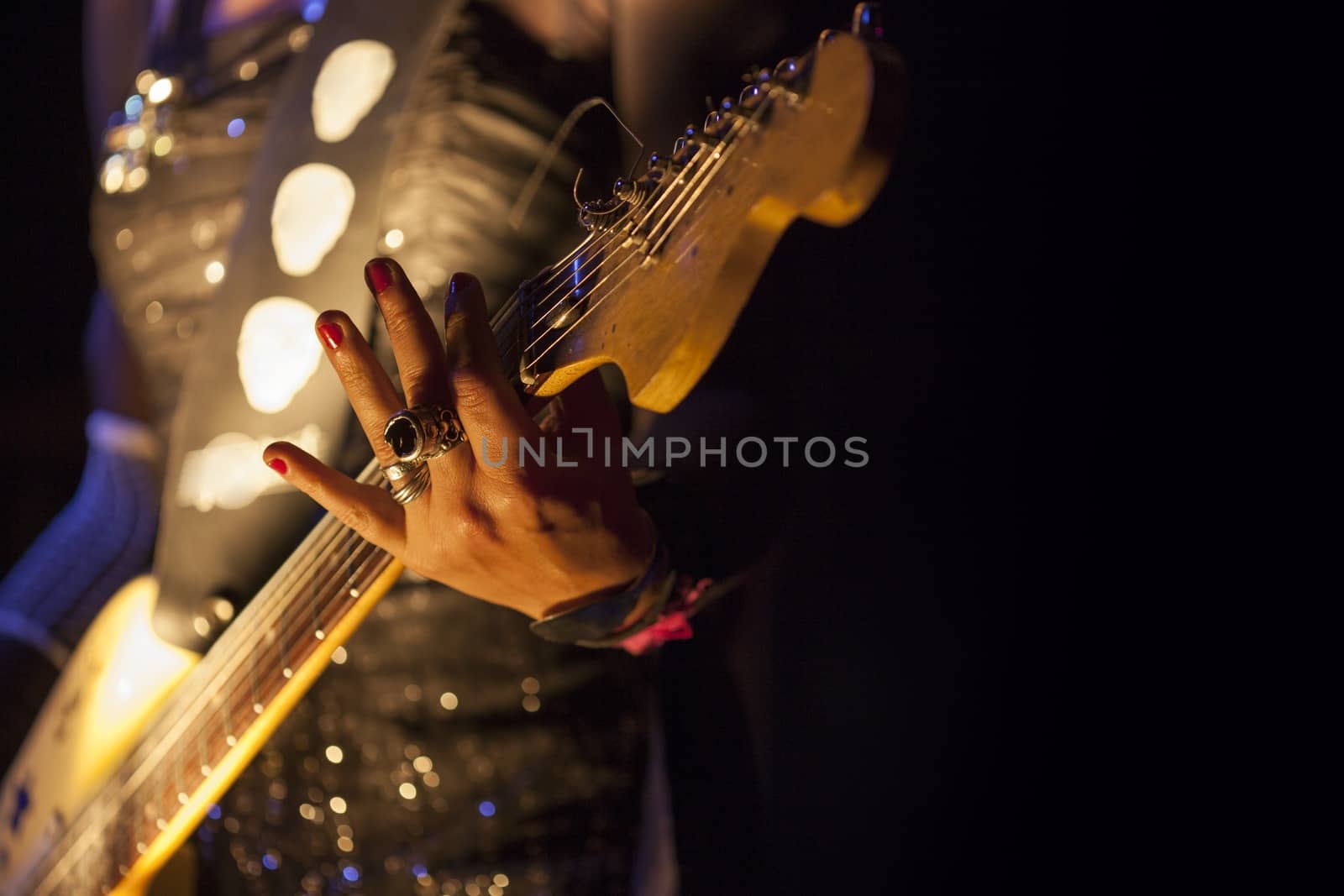 Picture of a woman playing electric guitar
