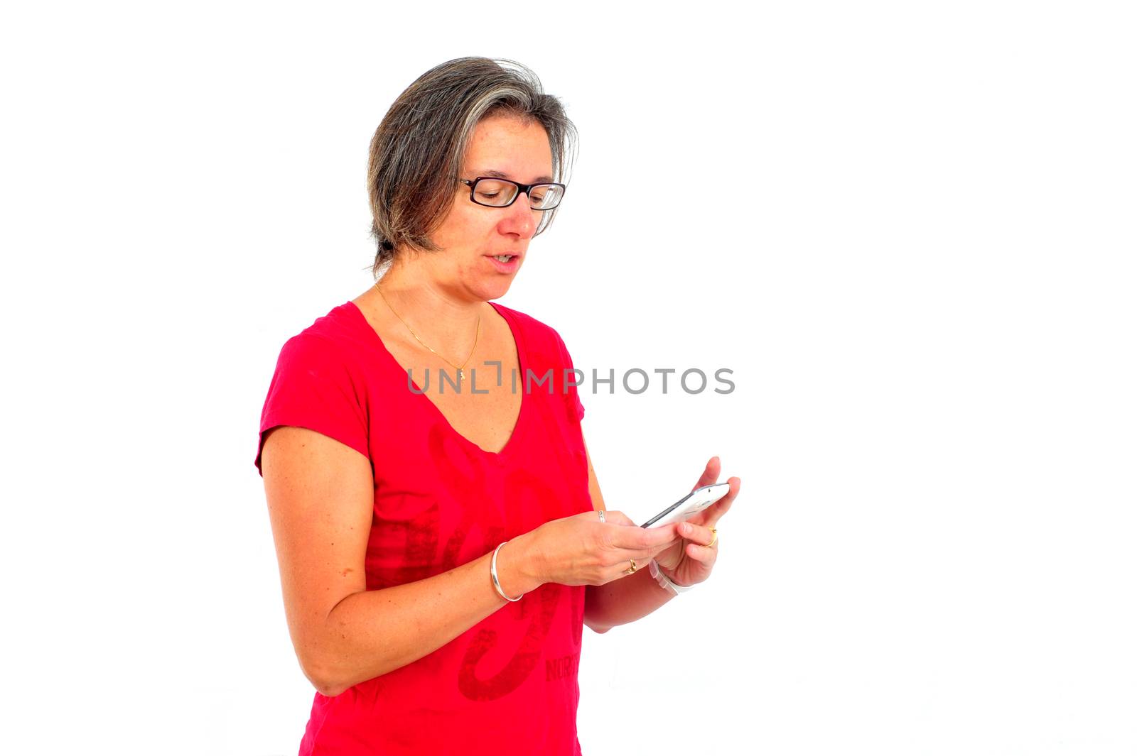 Woman in red t shirt on smartphone in studio by seawaters