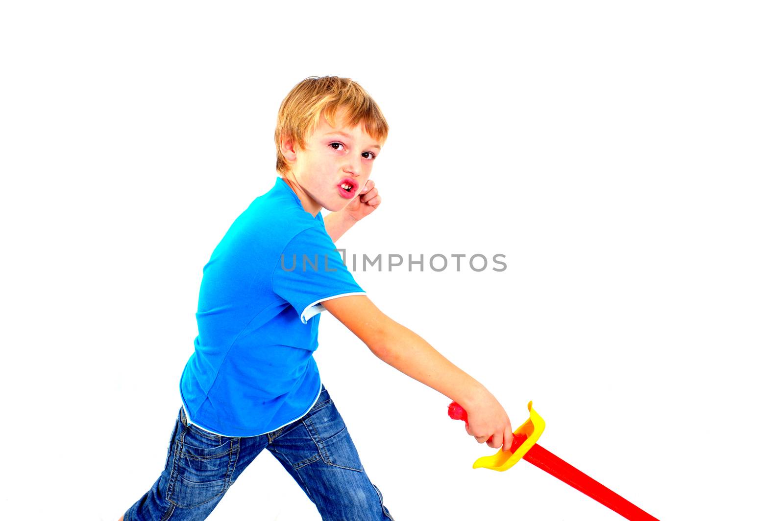 A young boy playing with sword on a white background