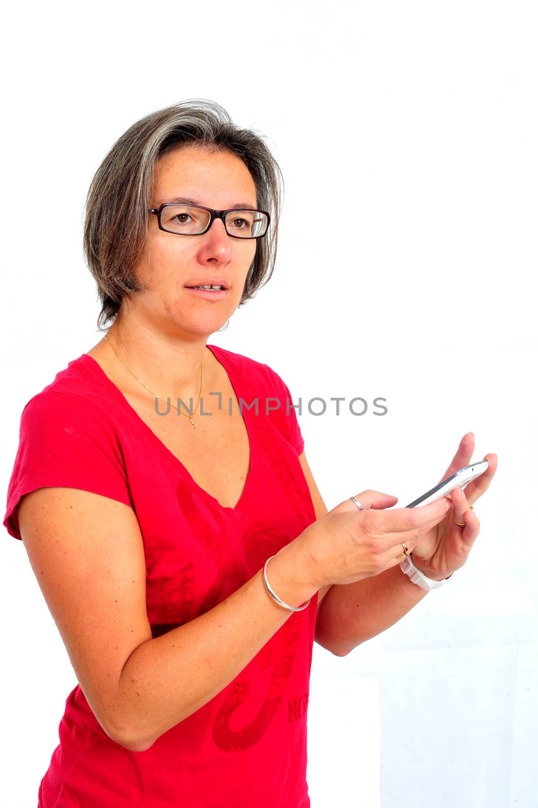 Woman in red t shirt on smartphone in studio by seawaters