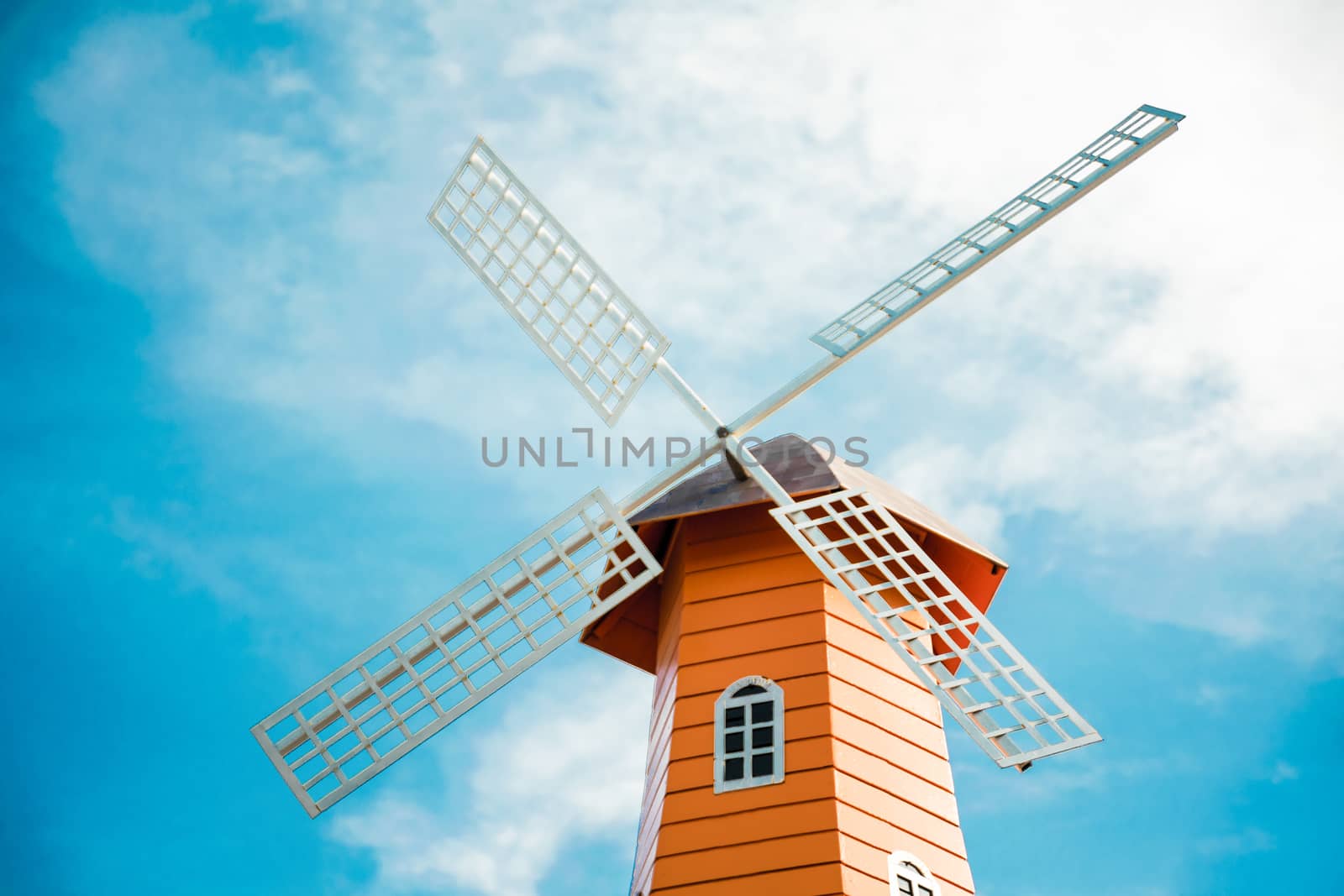 windmills over rows on the sky background