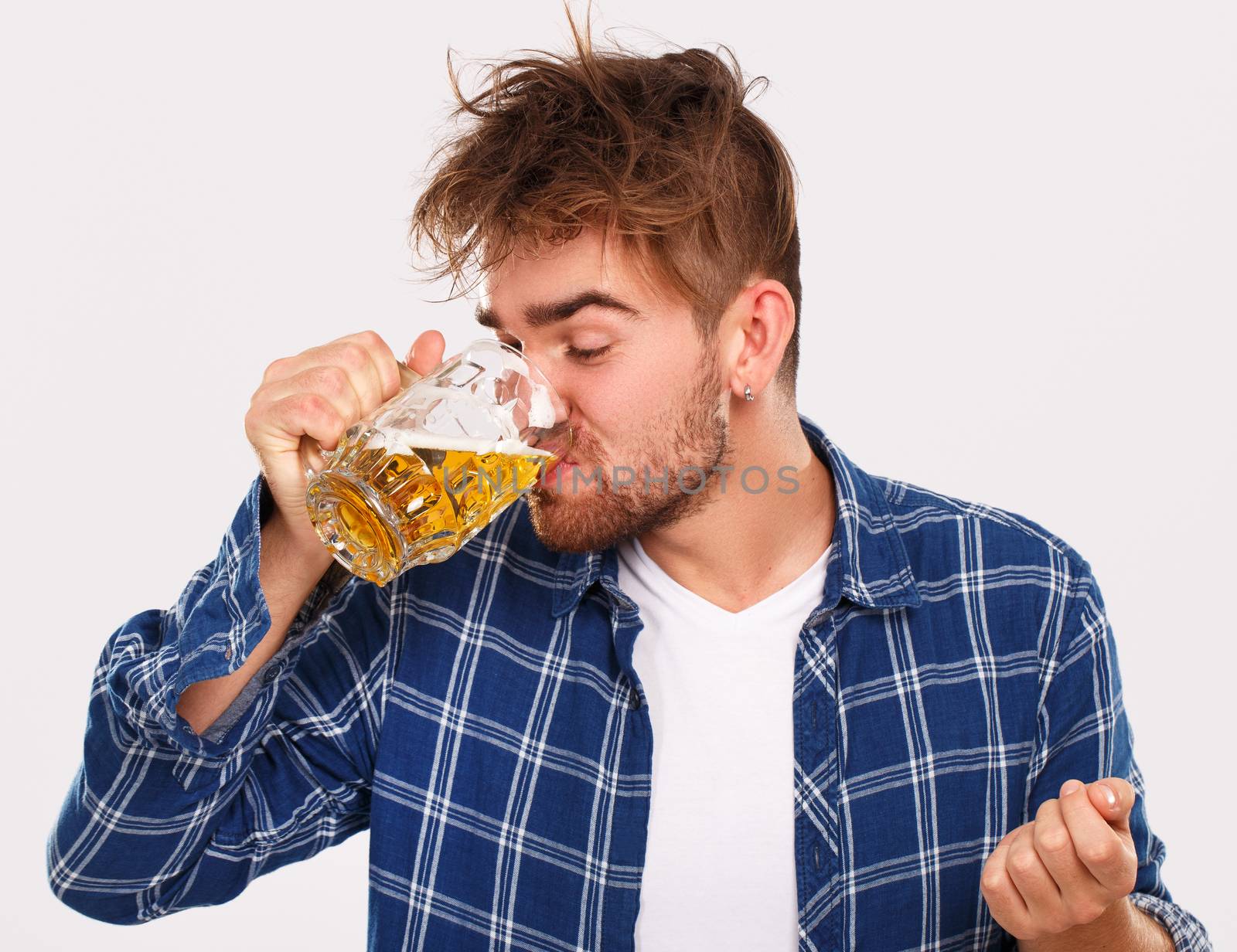 Alcohol. Guy in blue shirt with beer by rufatjumali