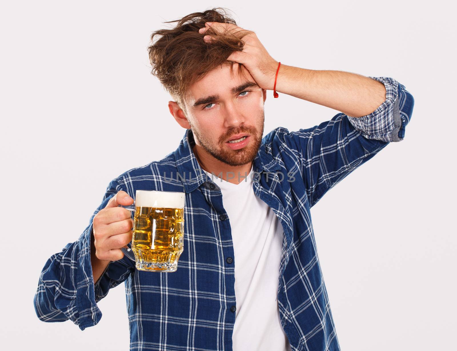 Alcohol. Guy in blue shirt with beer by rufatjumali