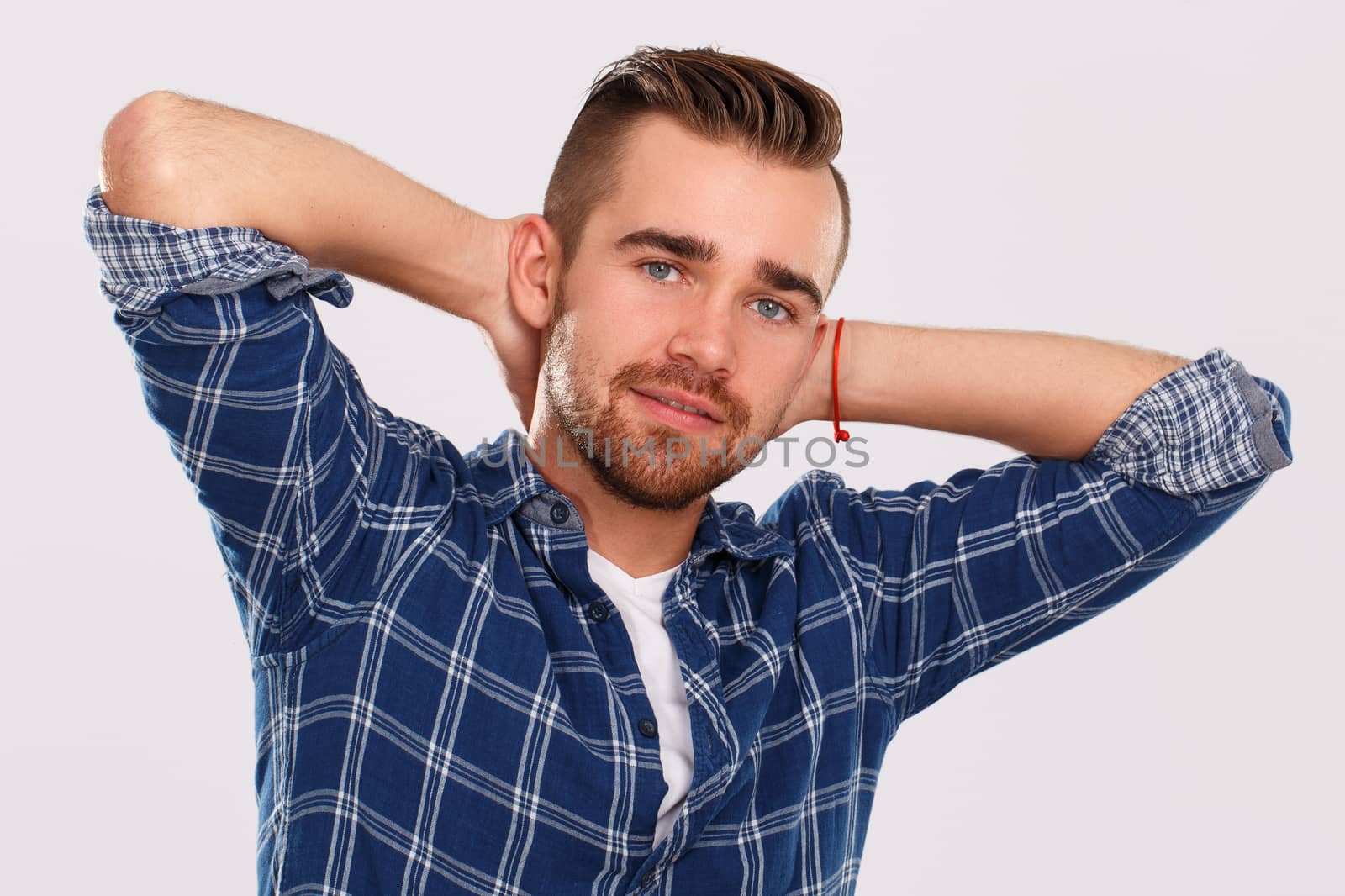 Emotions, feelings. Young guy with on a white background