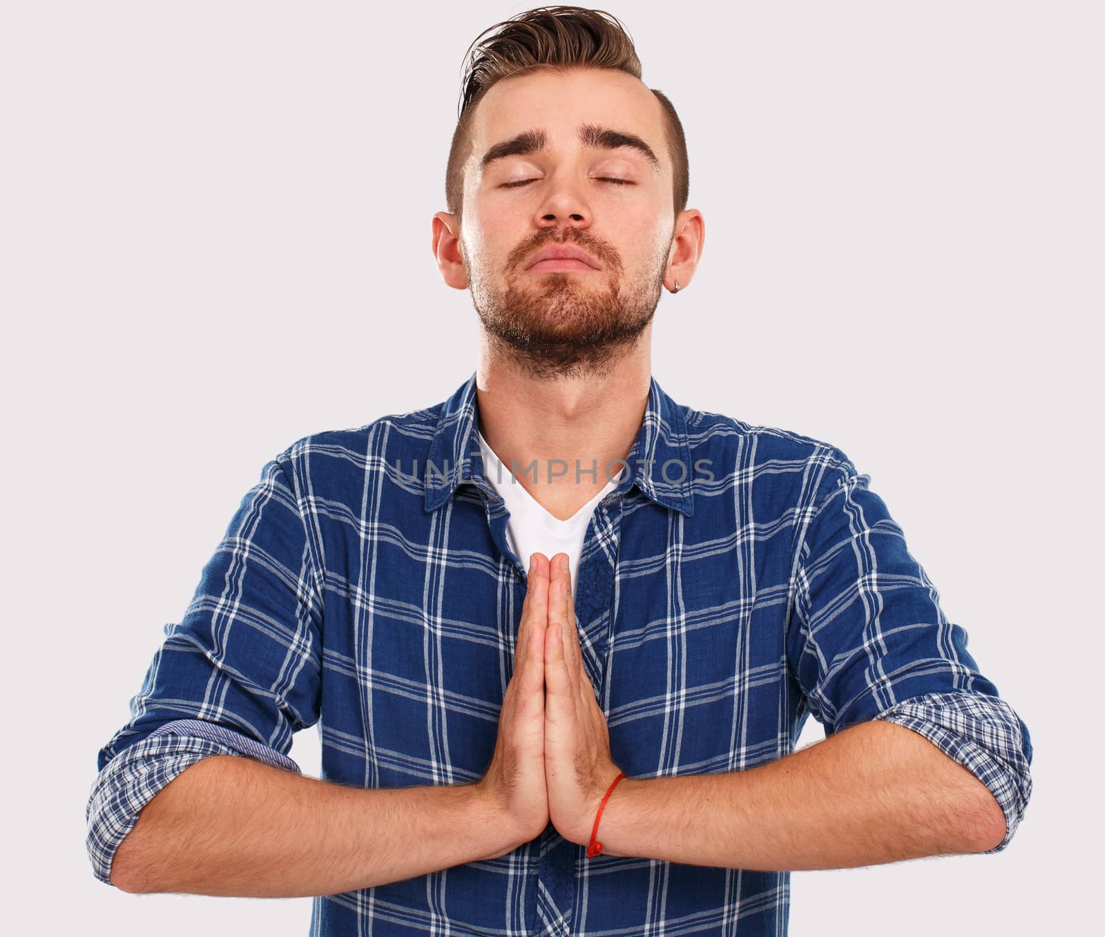 Emotions, feelings. Young guy with on a white background