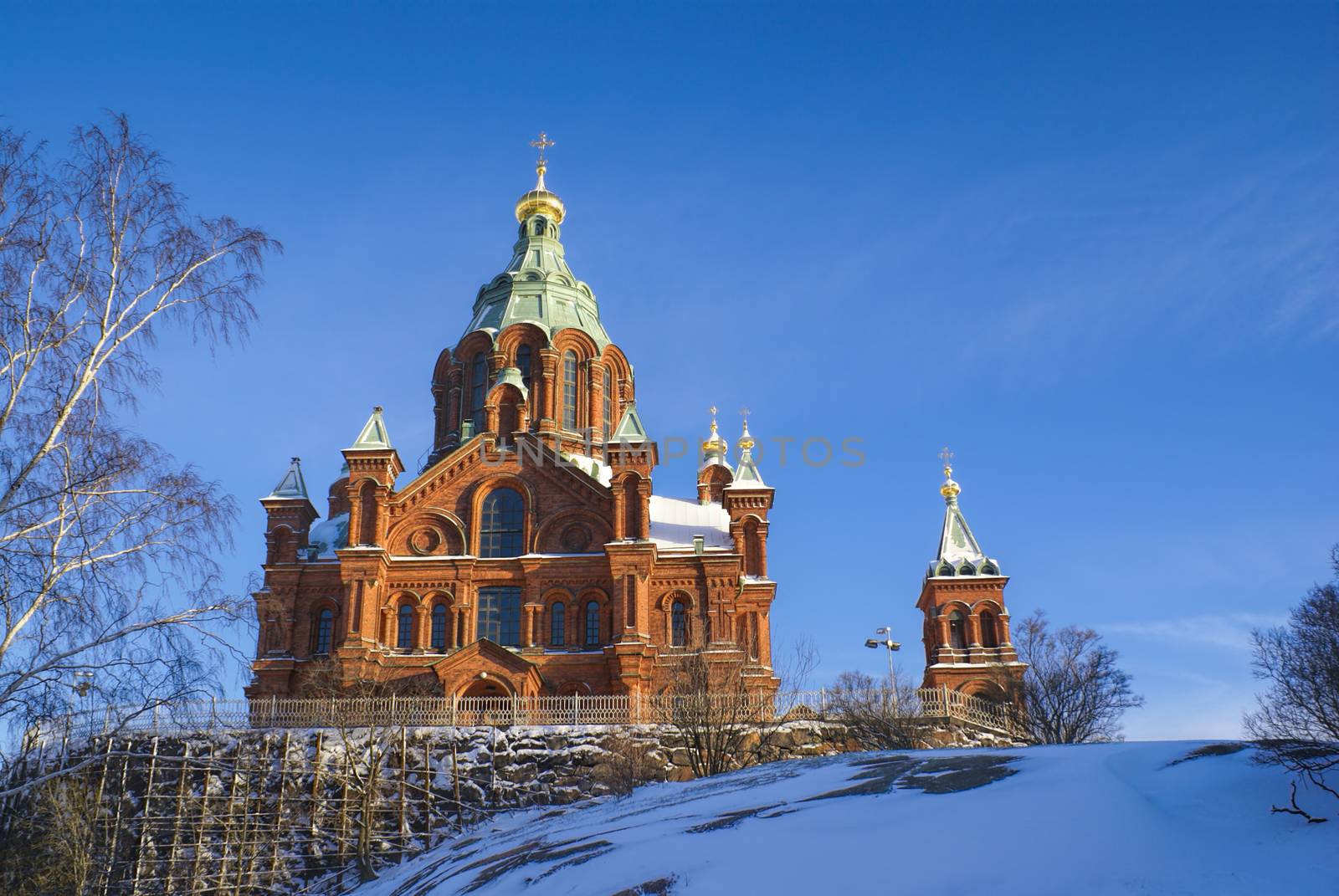 Picturesque view of the sunlit Uspenski Cathedral in Helsinki              