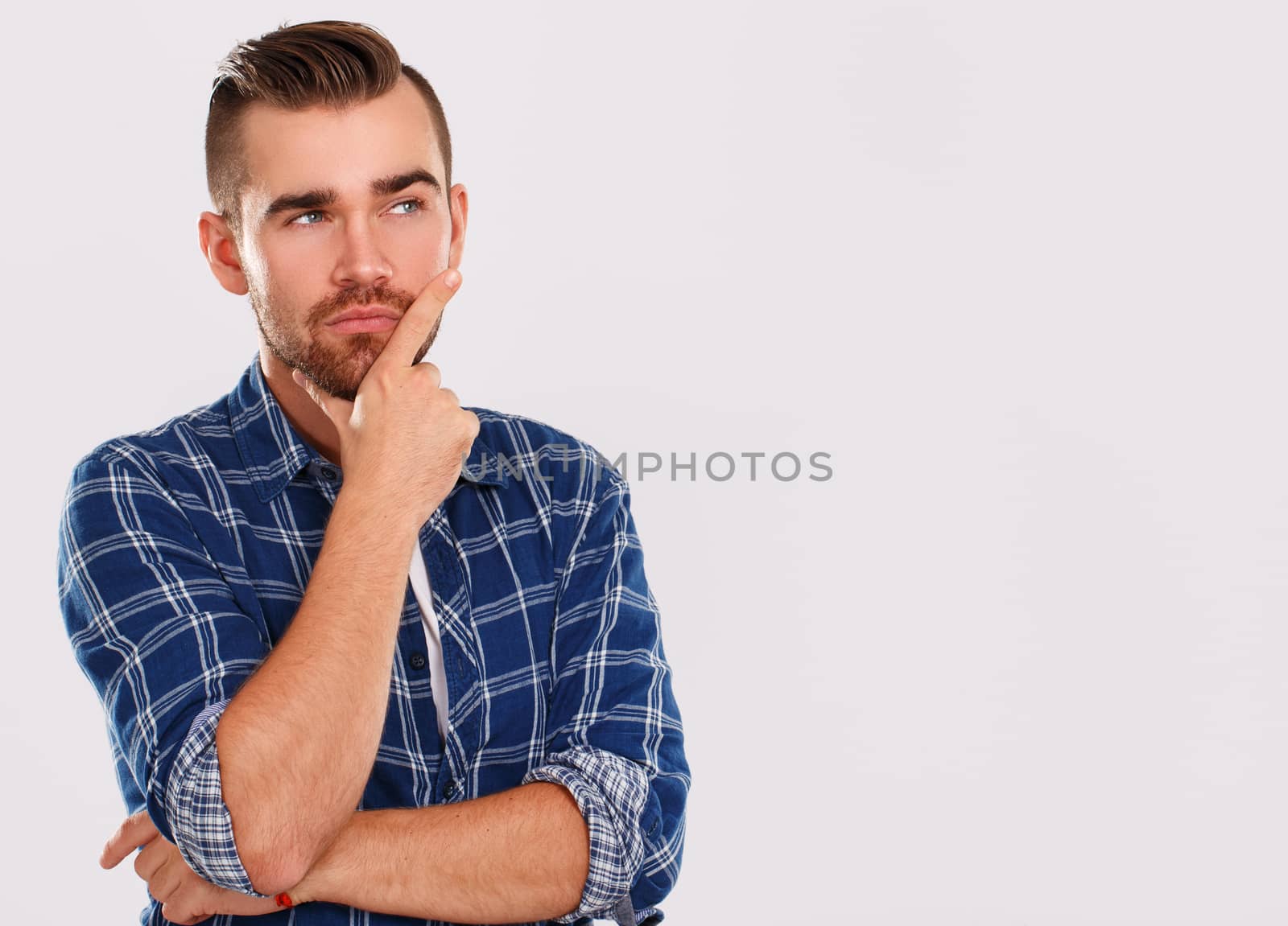 Emotions, feelings. Young guy with on a white background