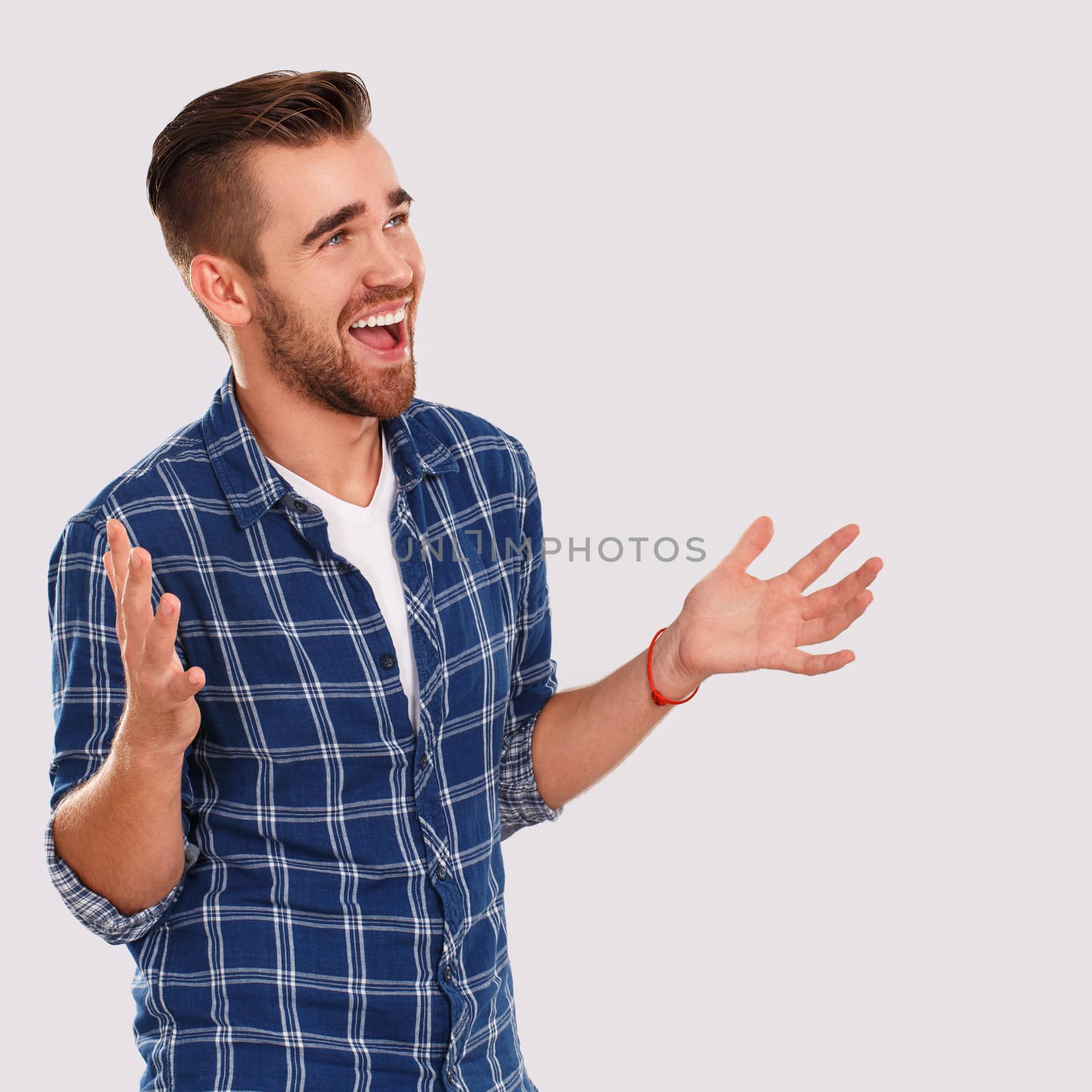 Emotions, feelings. Young guy with on a white background