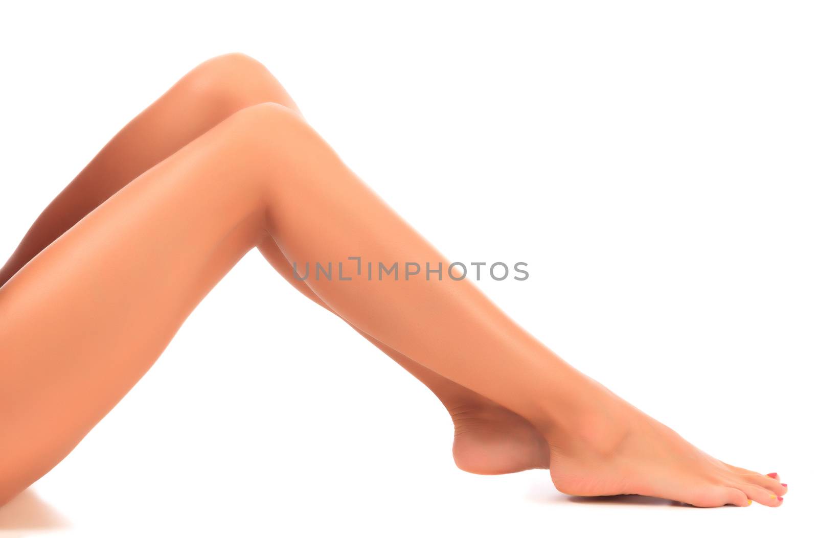 Long female legs on white background, isolated