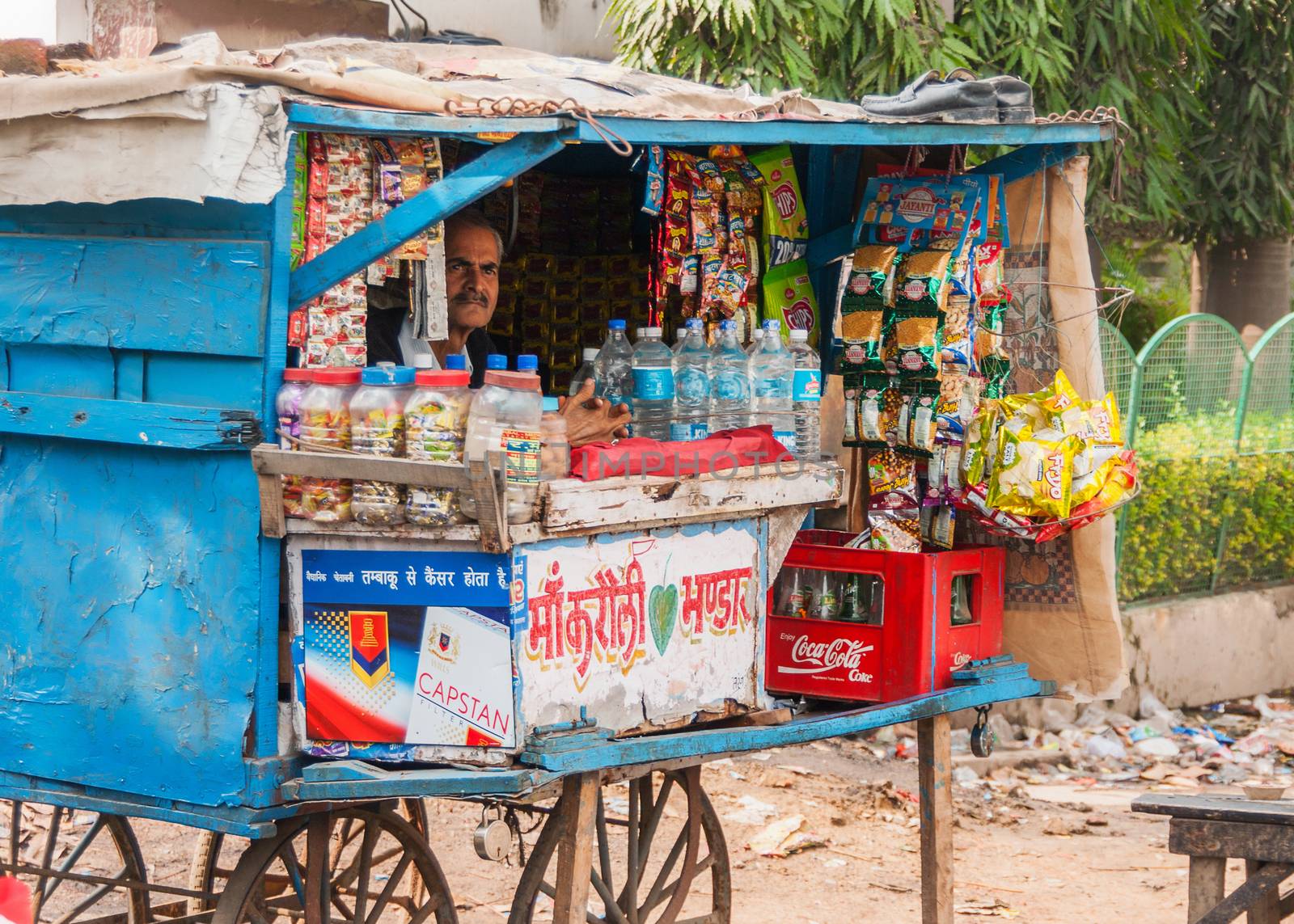 Street vendor sells basic grocery products by Claudine