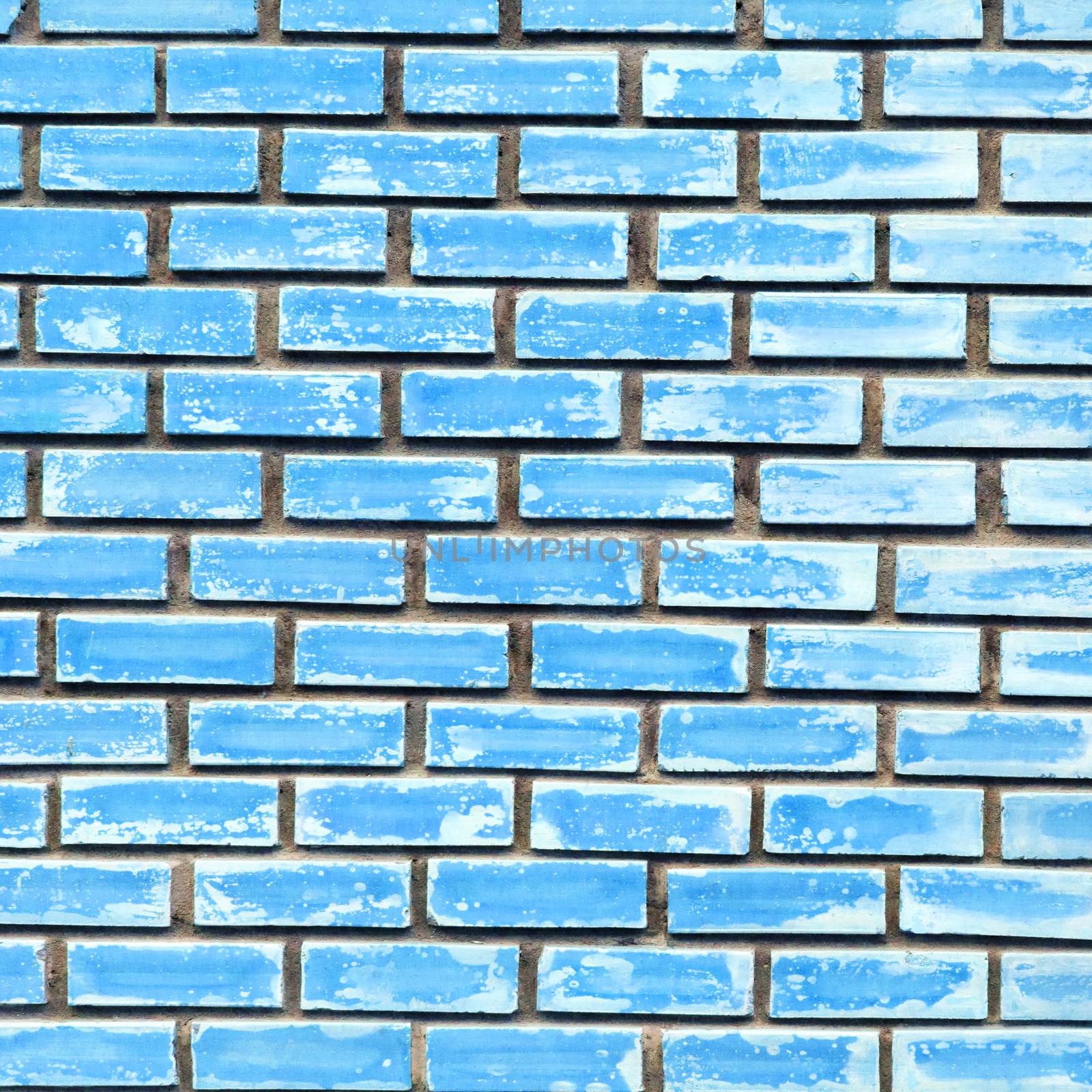 Blue brick wall texture background by nopparats