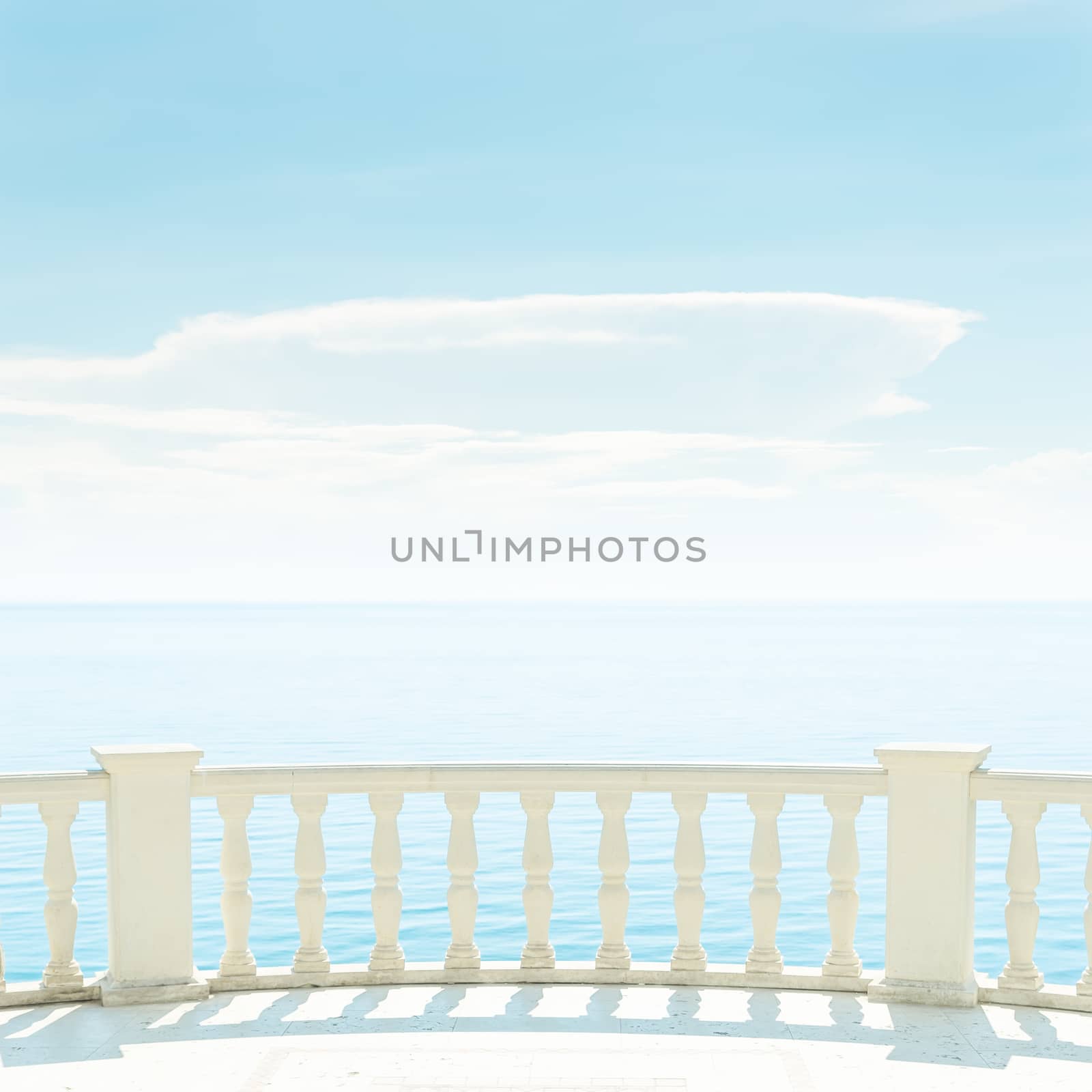 balcony over sea and light clouds in blue sky