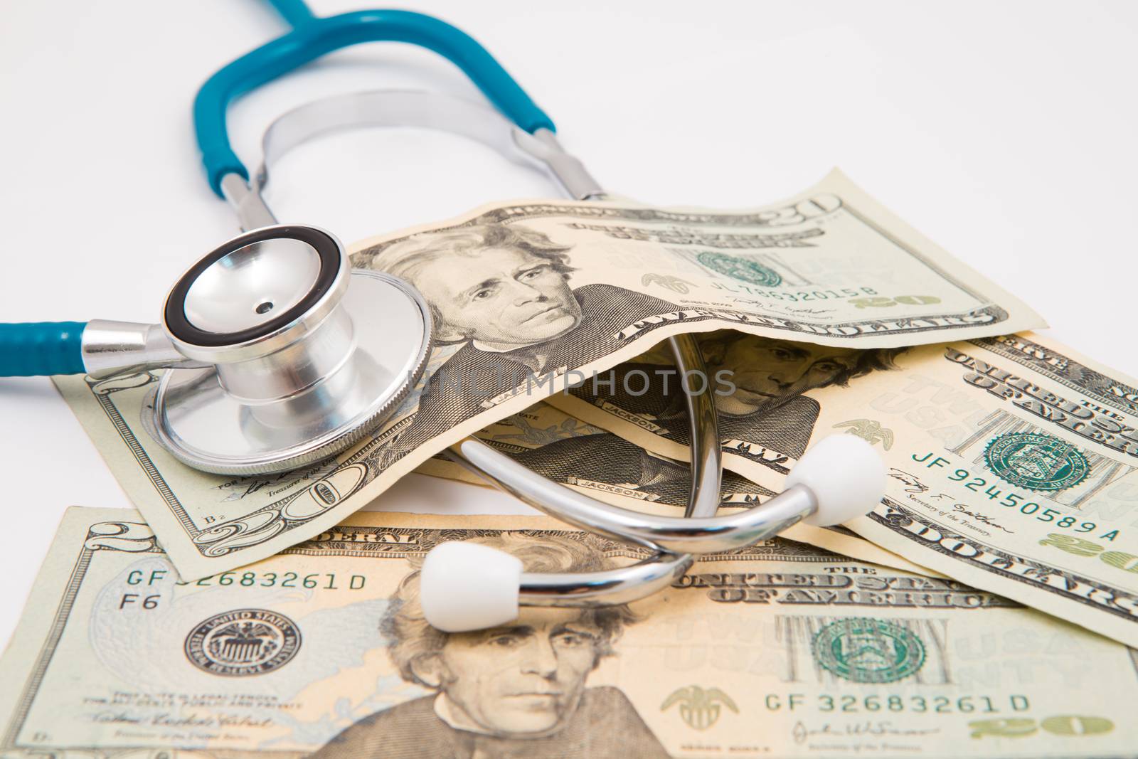 health care costs - Stethoscope on money background