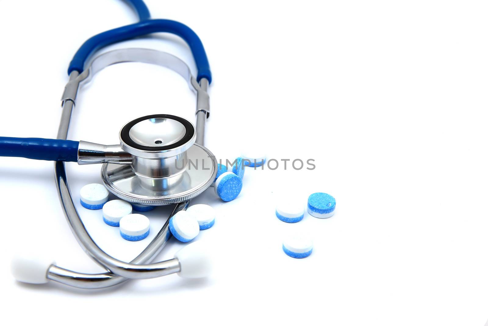 Pills and stethoscope